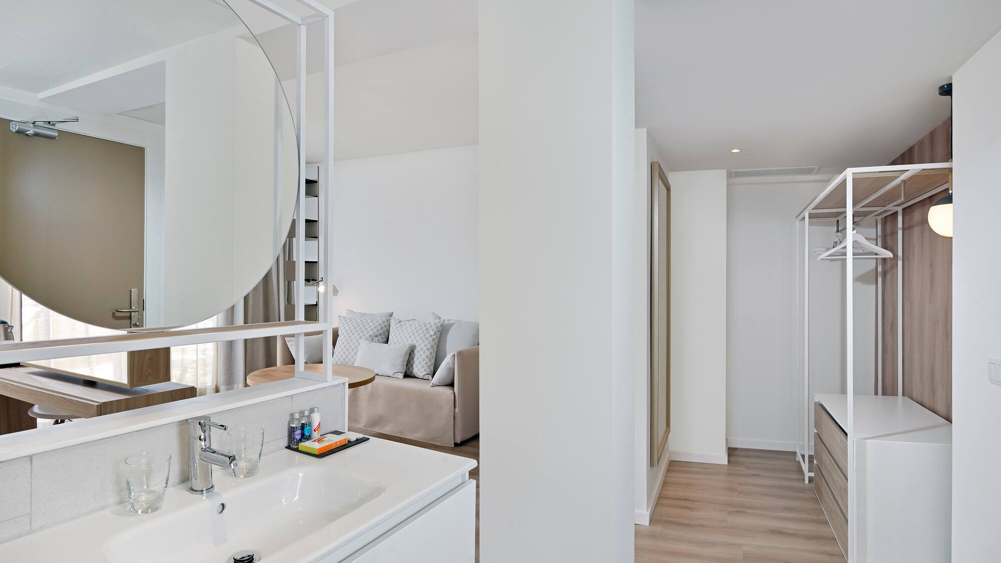 a bathroom with a mirror and a couch