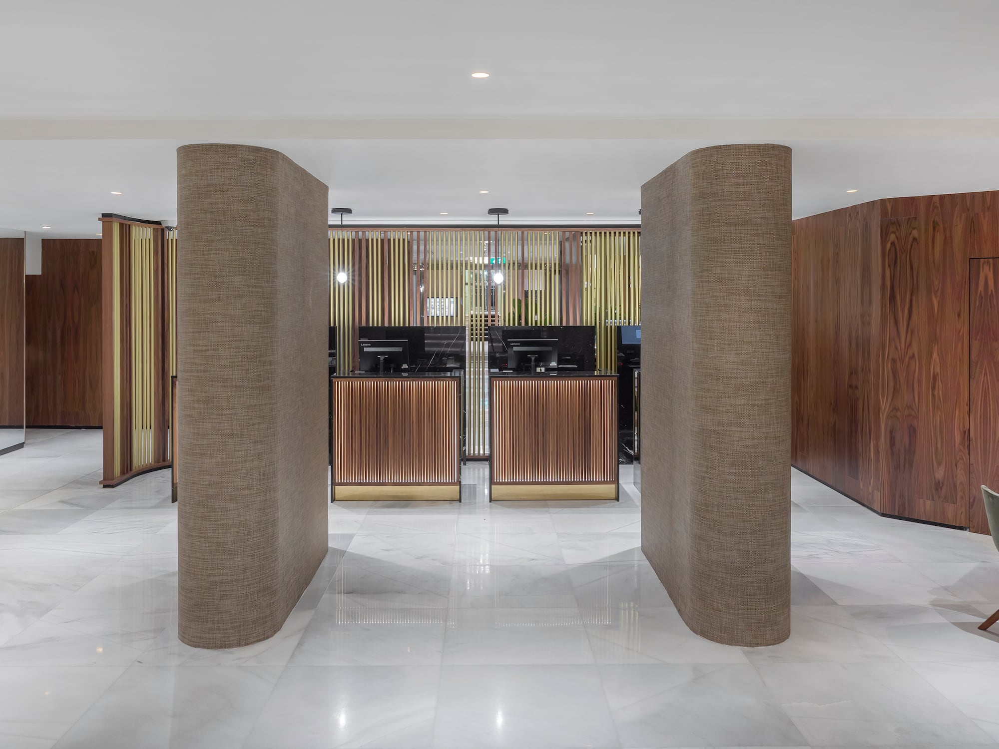 a lobby with columns and a counter