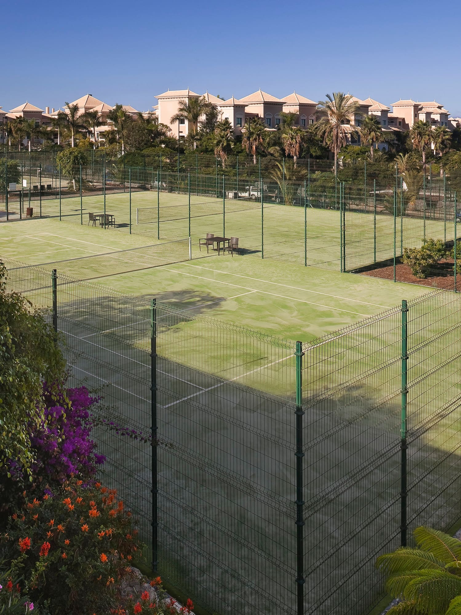 a tennis court with a fence around it