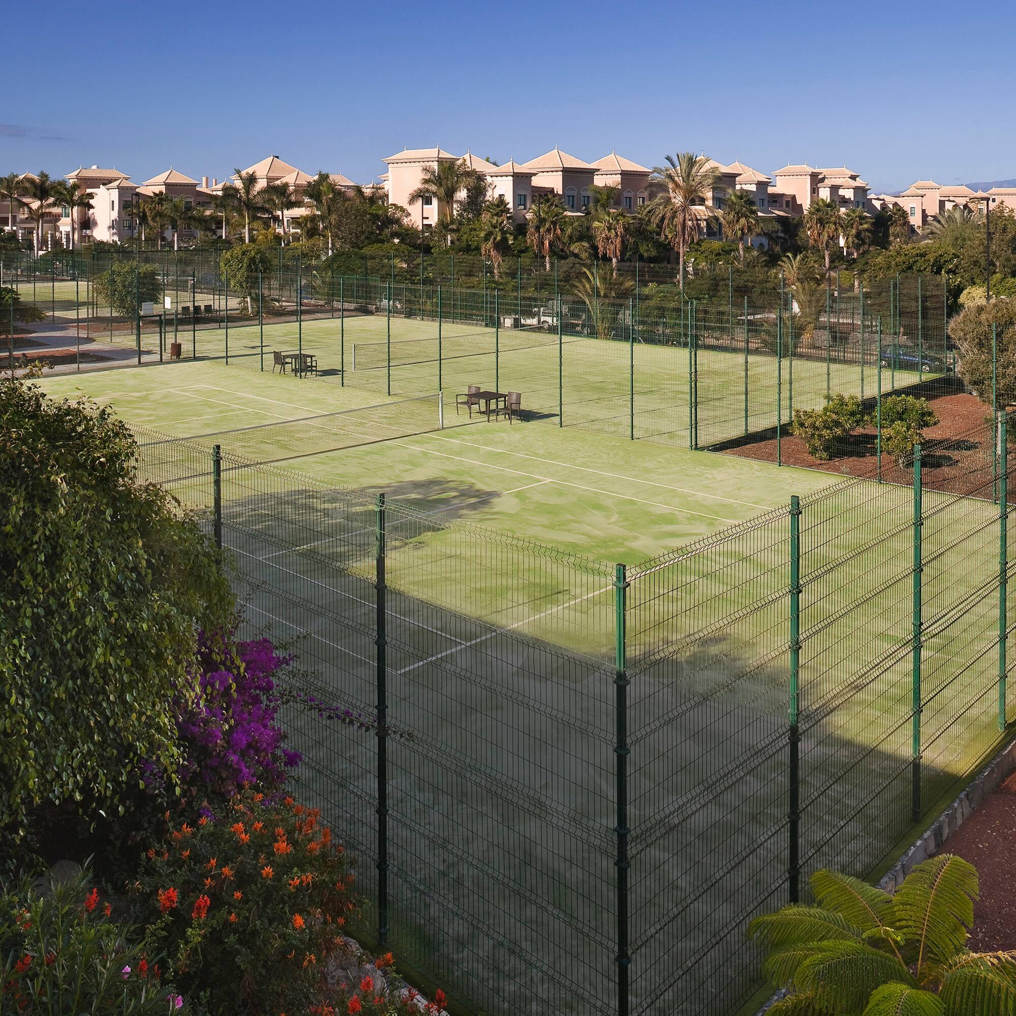 a tennis court with a fence around it