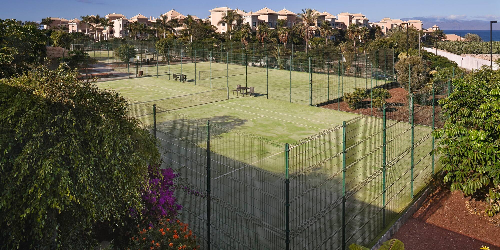 a tennis court with a fence around it