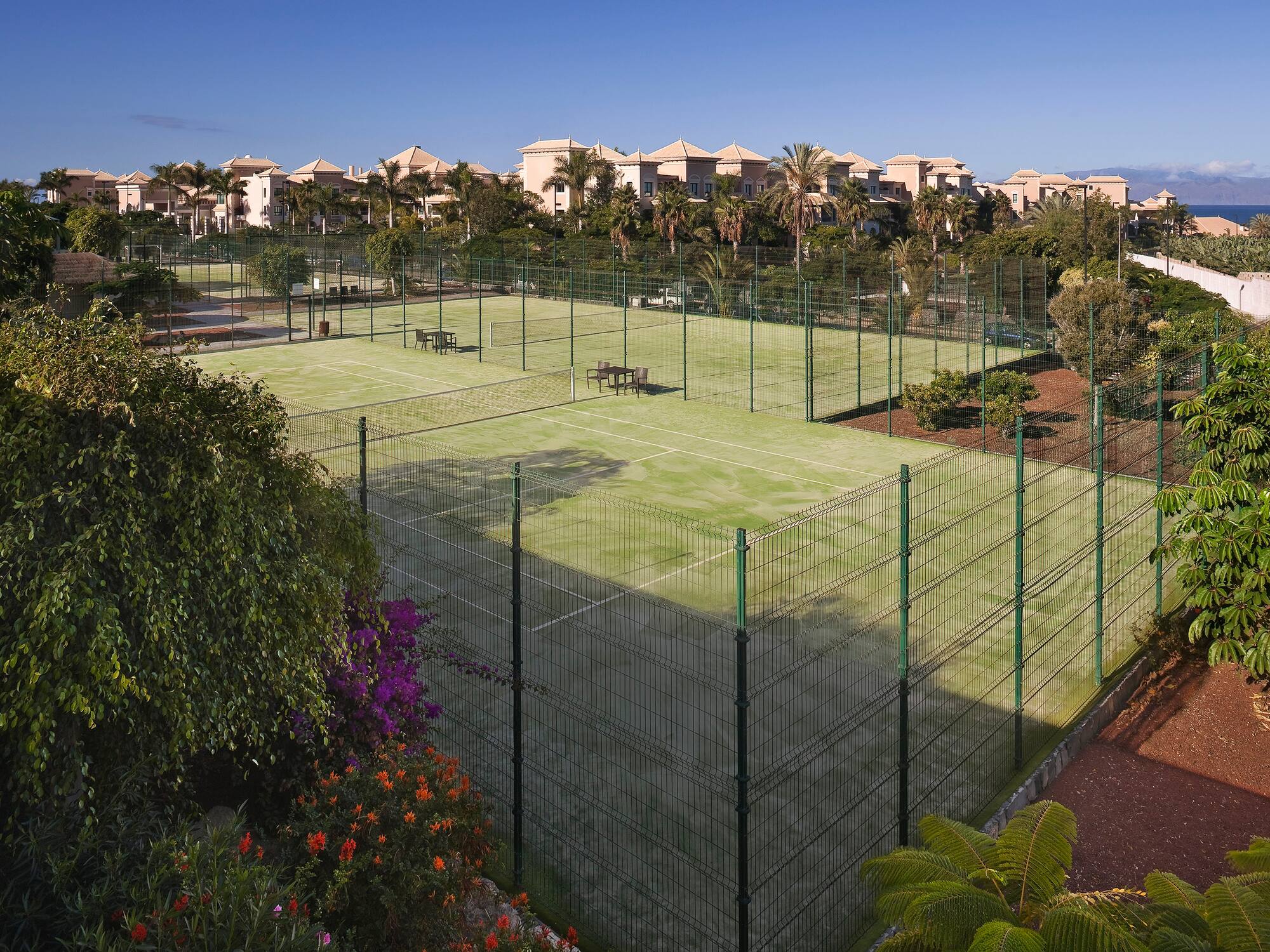 a tennis court with a fence around it