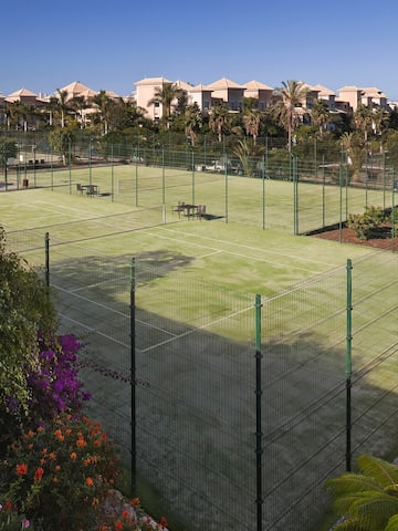 a tennis court with a fence around it
