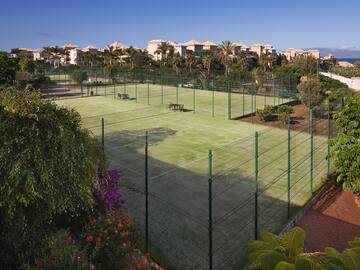 a tennis court with a fence around it