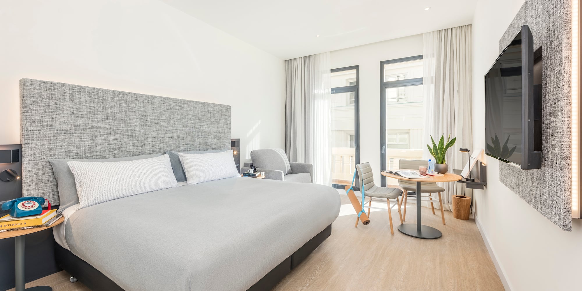 a bedroom with a bed and a table