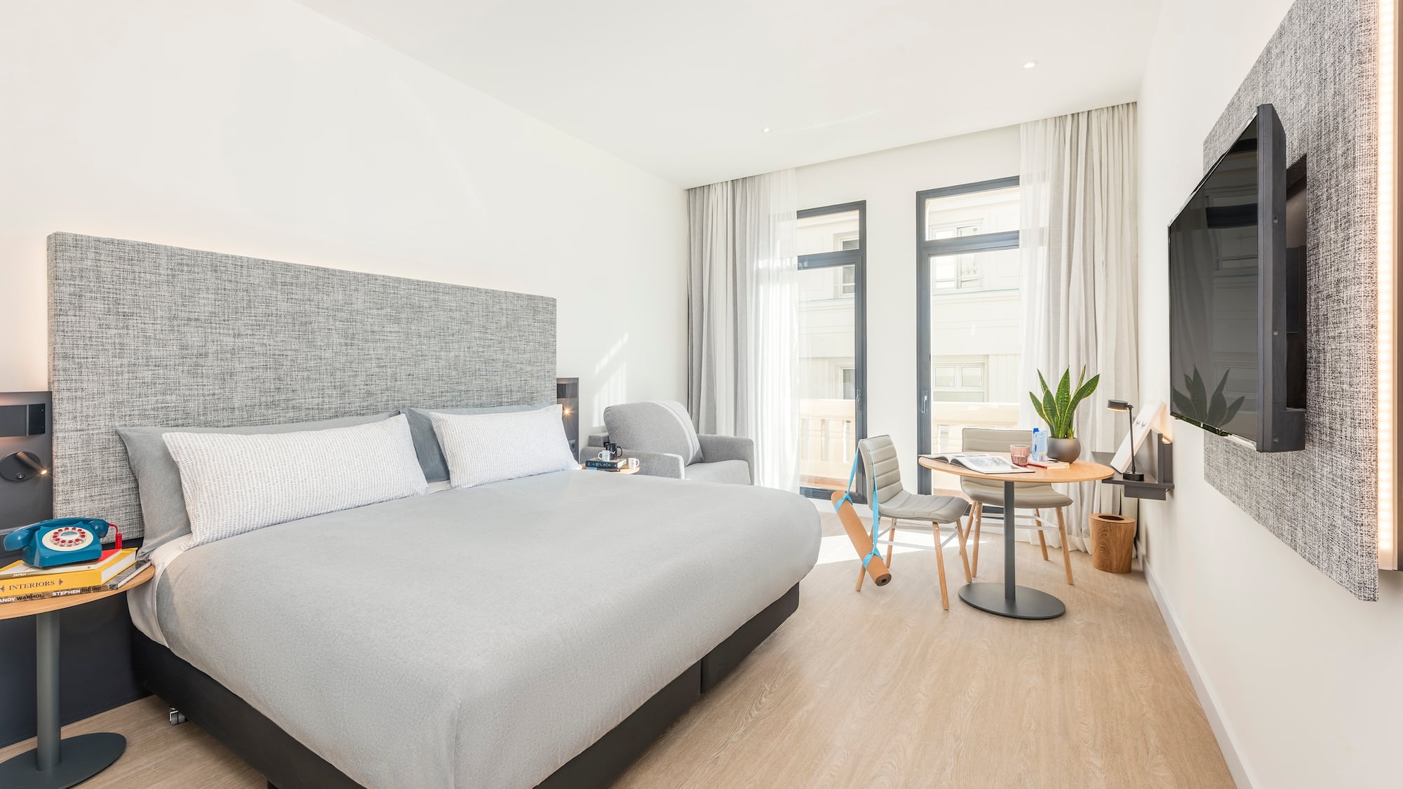 a bedroom with a bed and a table