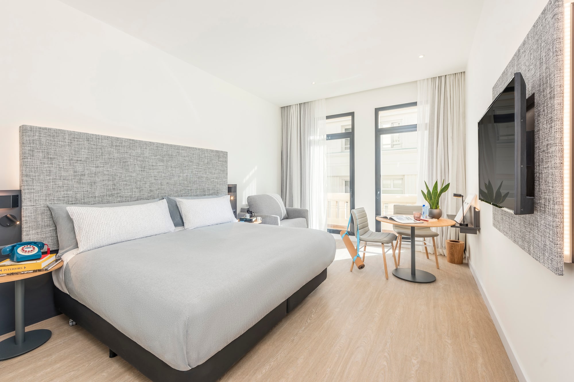 a bedroom with a bed and a table