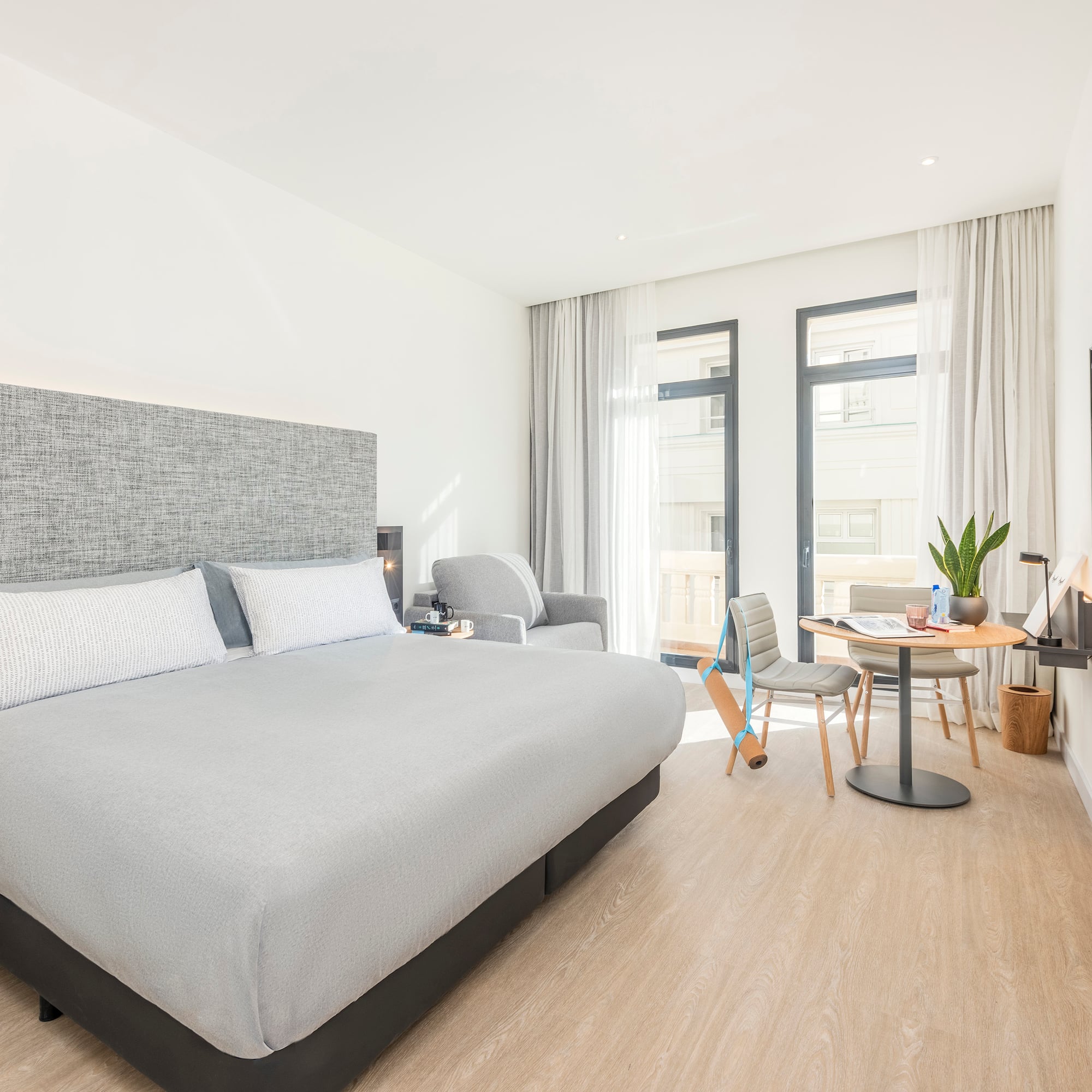 a bedroom with a bed and a table