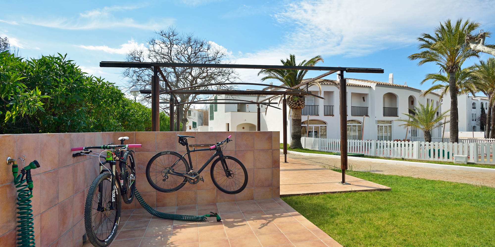 two bicycles parked on a patio