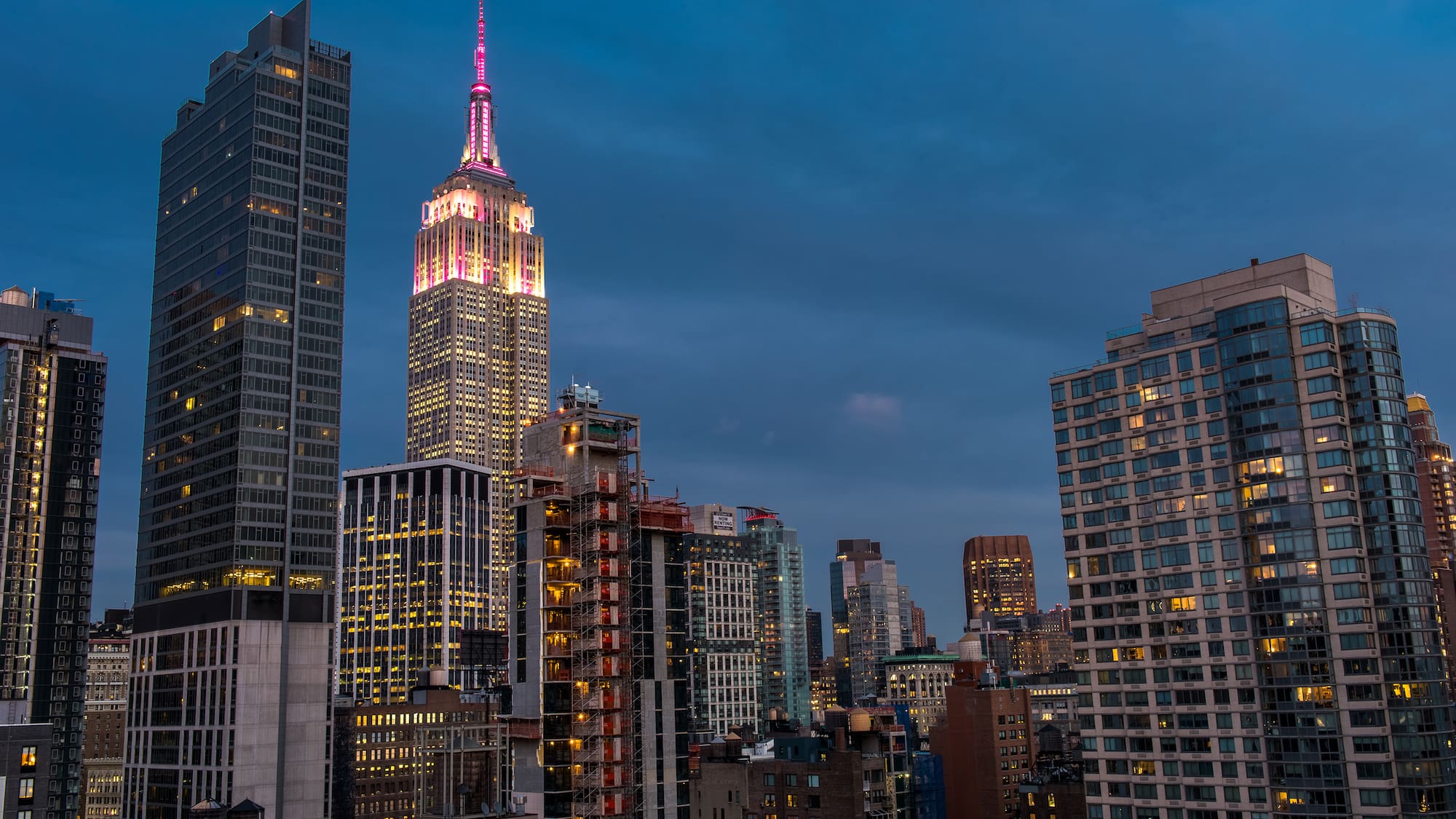 a city skyline with many tall buildings