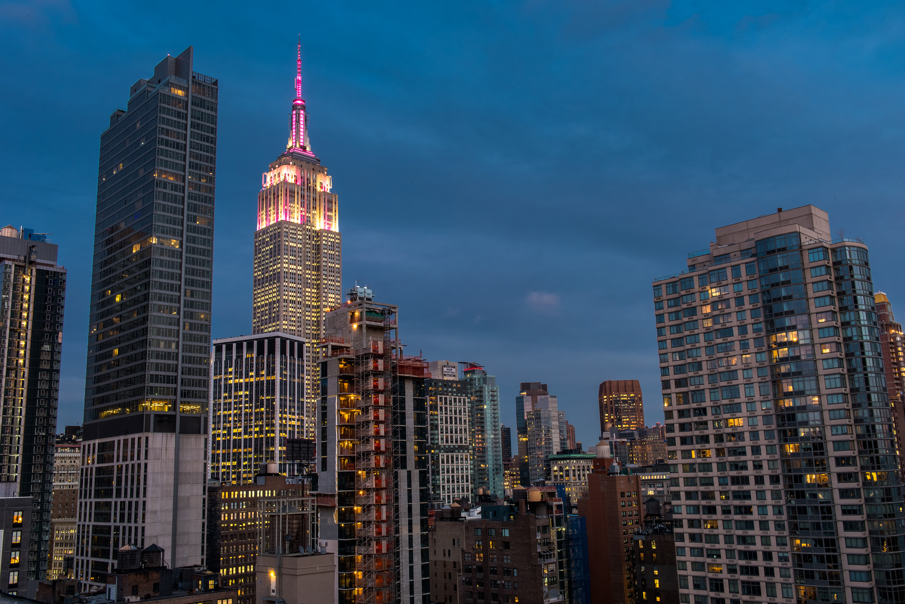 a city skyline with many tall buildings
