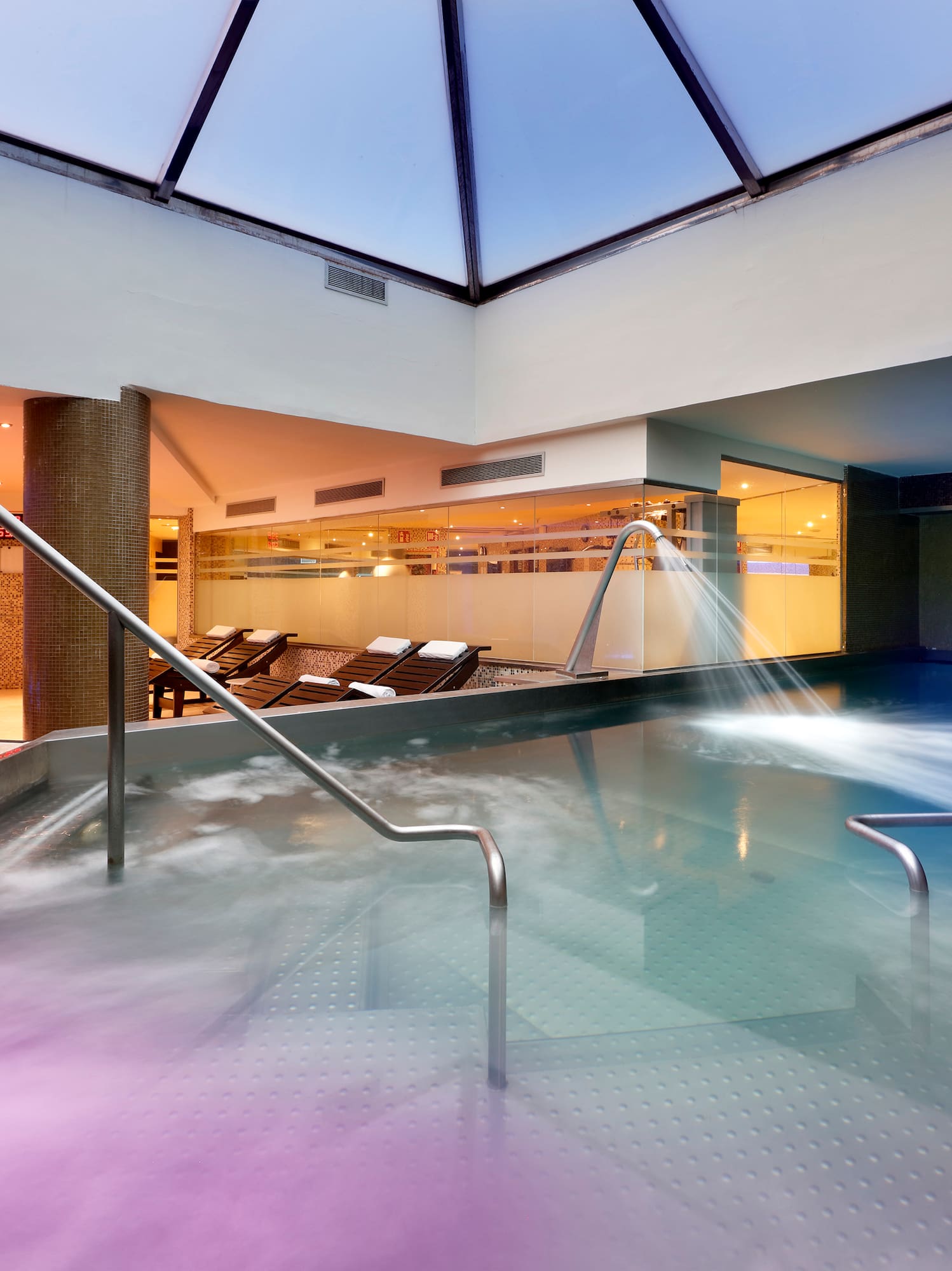 a swimming pool with water flowing out of it