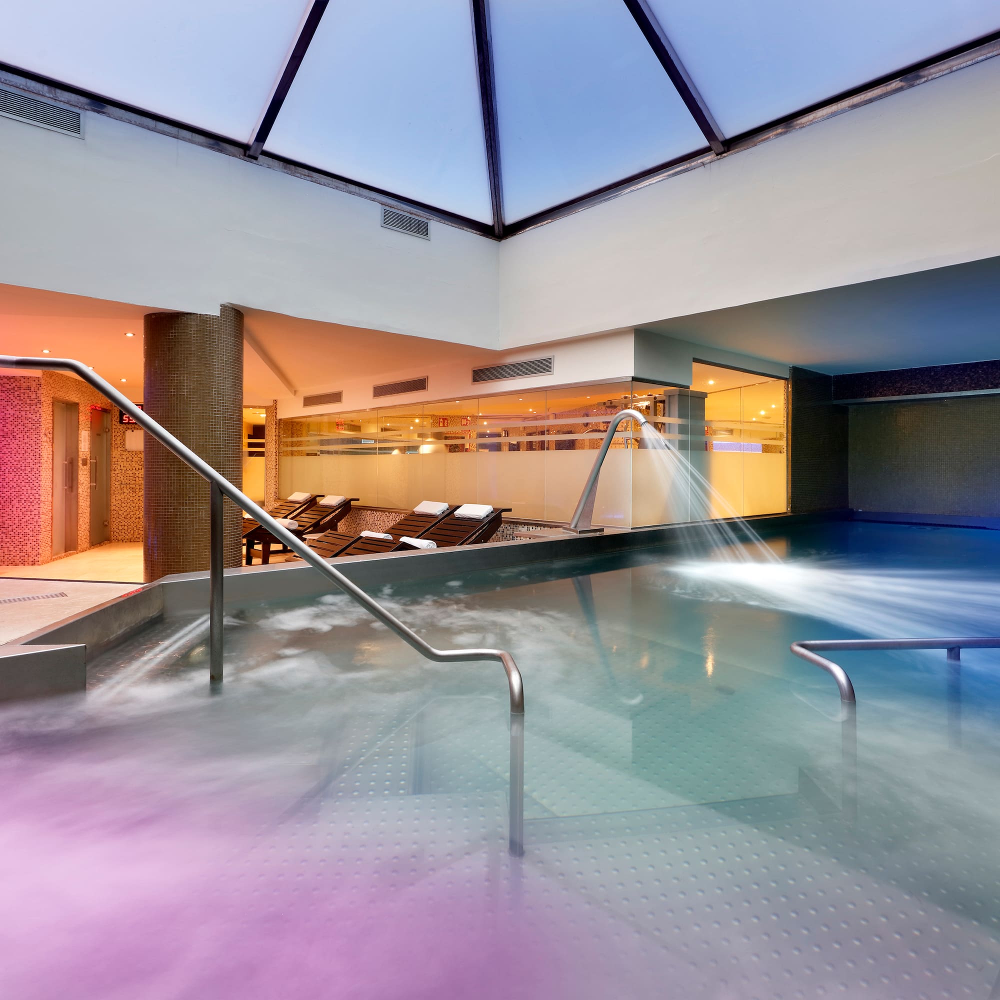 a swimming pool with water flowing out of it