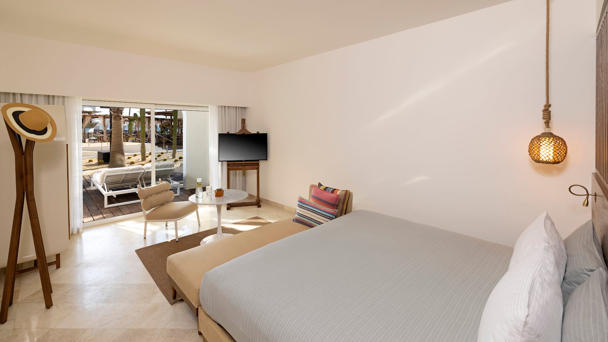 a room with a bed and a television