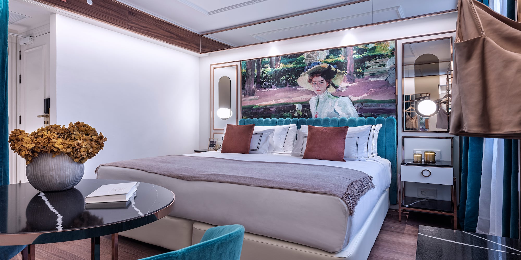 a bedroom with a bed and a table