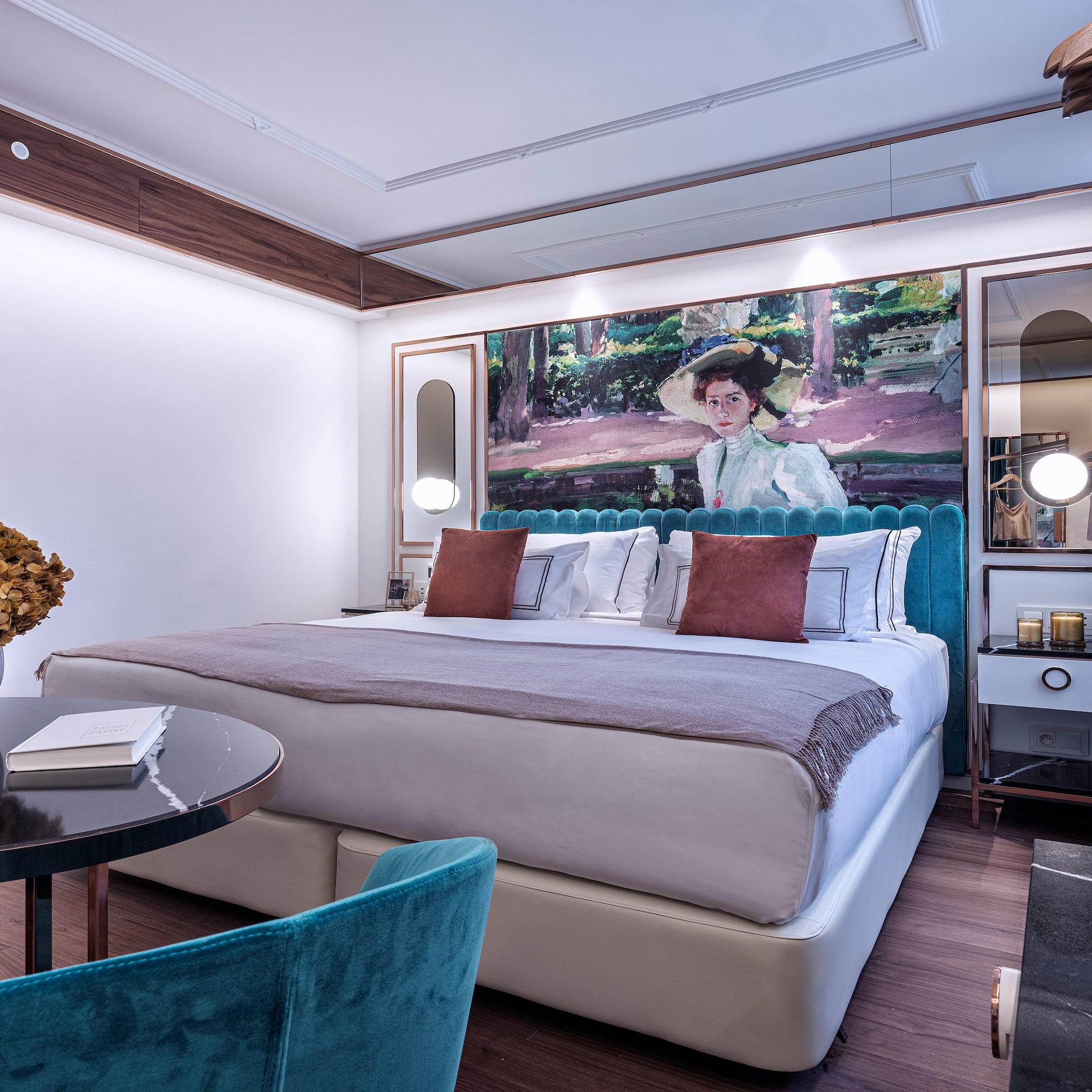 a bedroom with a bed and a table