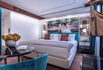 a bedroom with a bed and a table