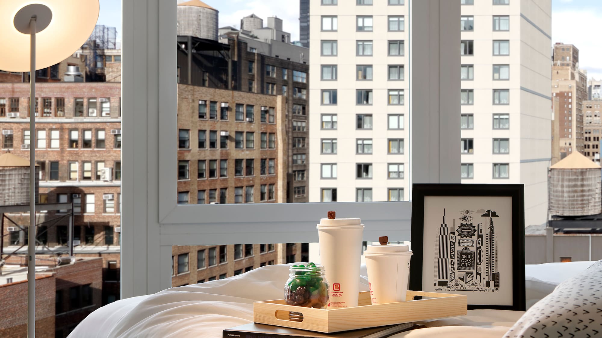 a tray of food on a bed