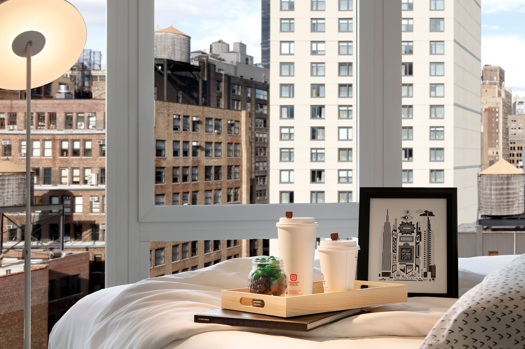 a tray of food on a bed