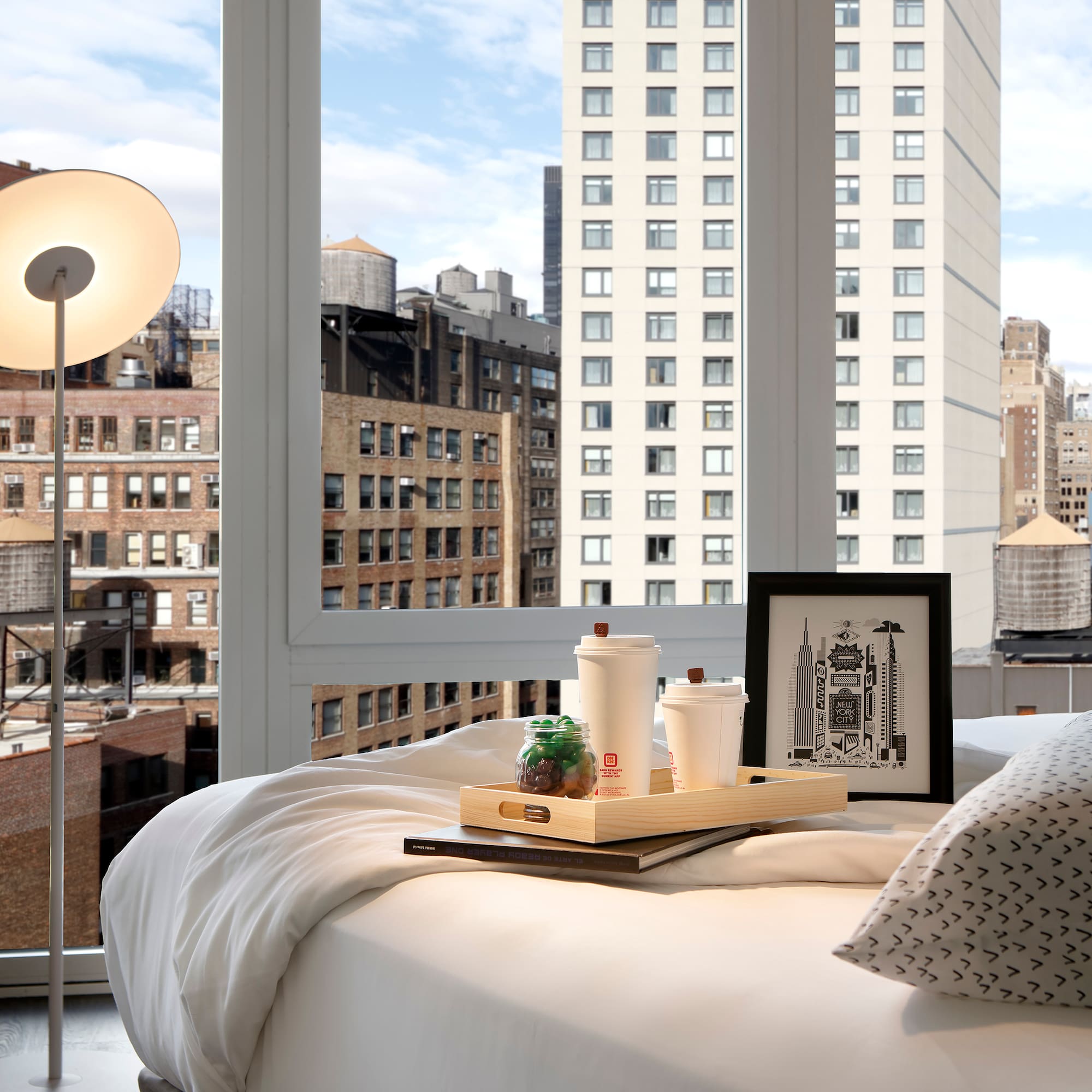 a tray of food on a bed