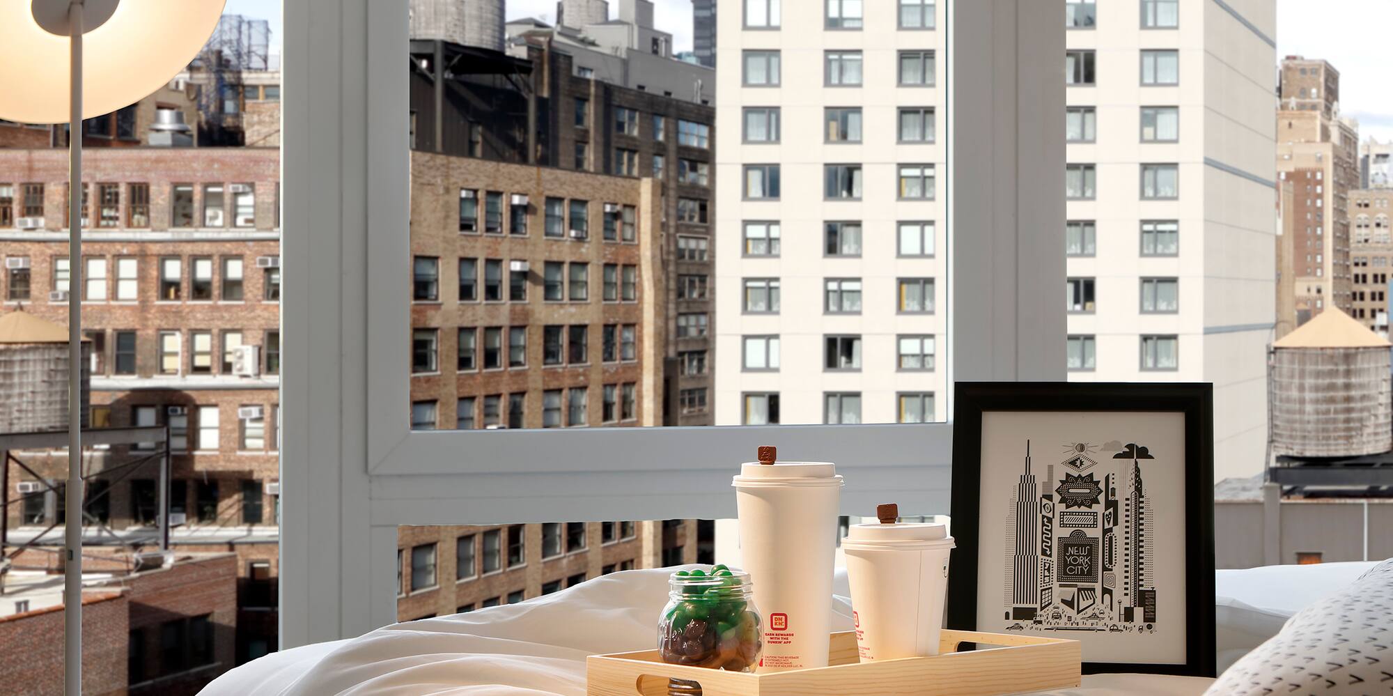 a tray of food on a bed