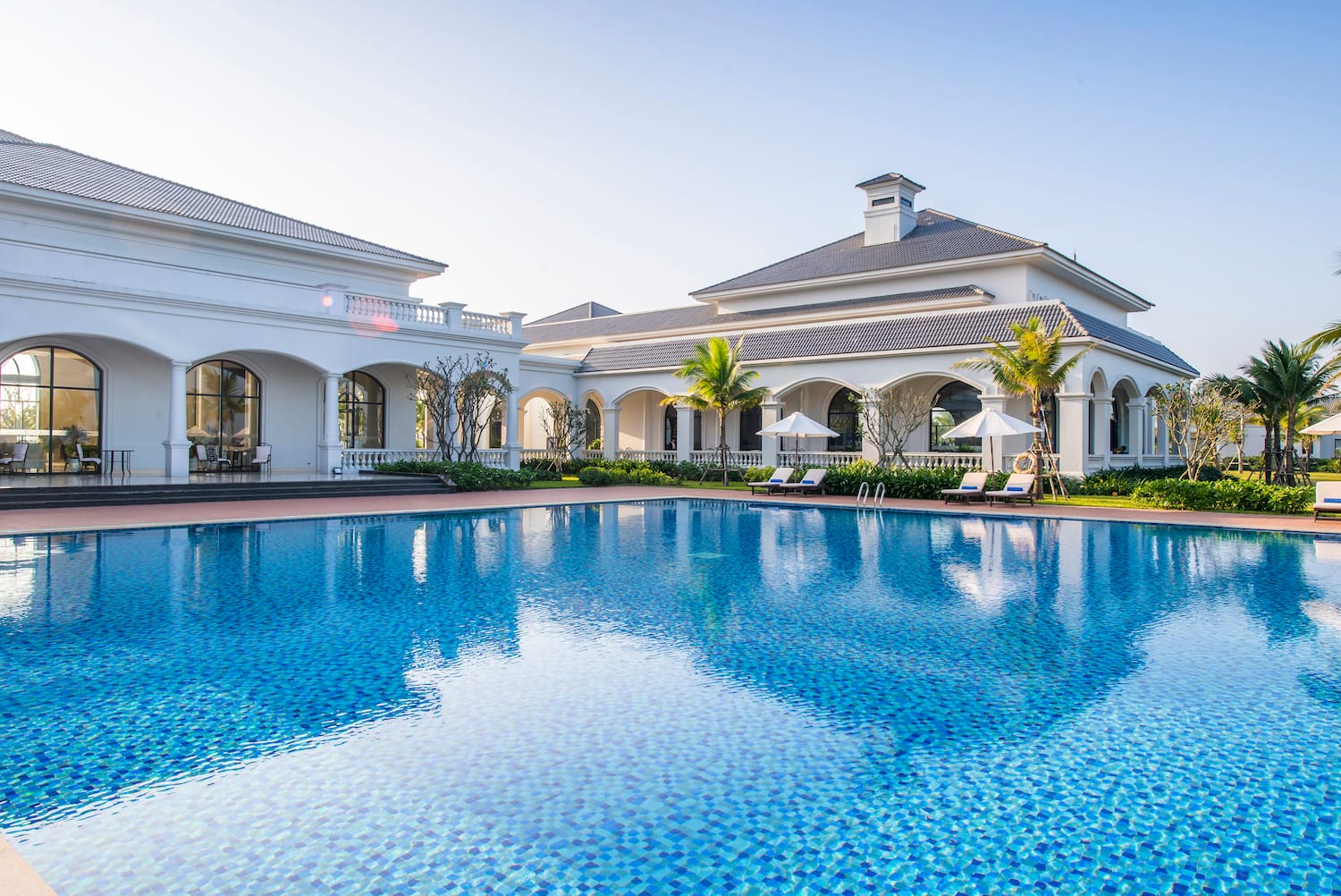 a swimming pool in front of a building