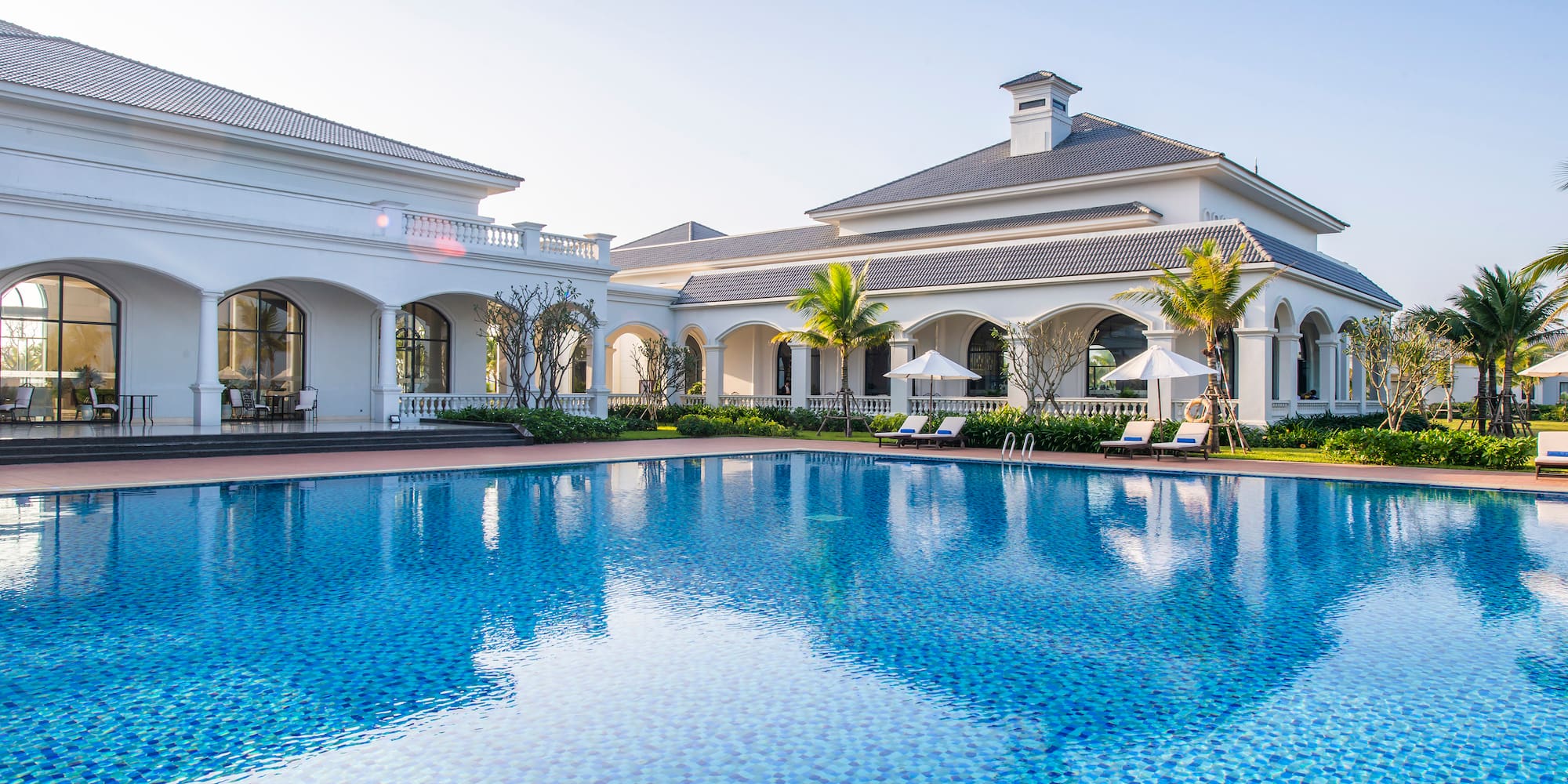 a swimming pool in front of a building