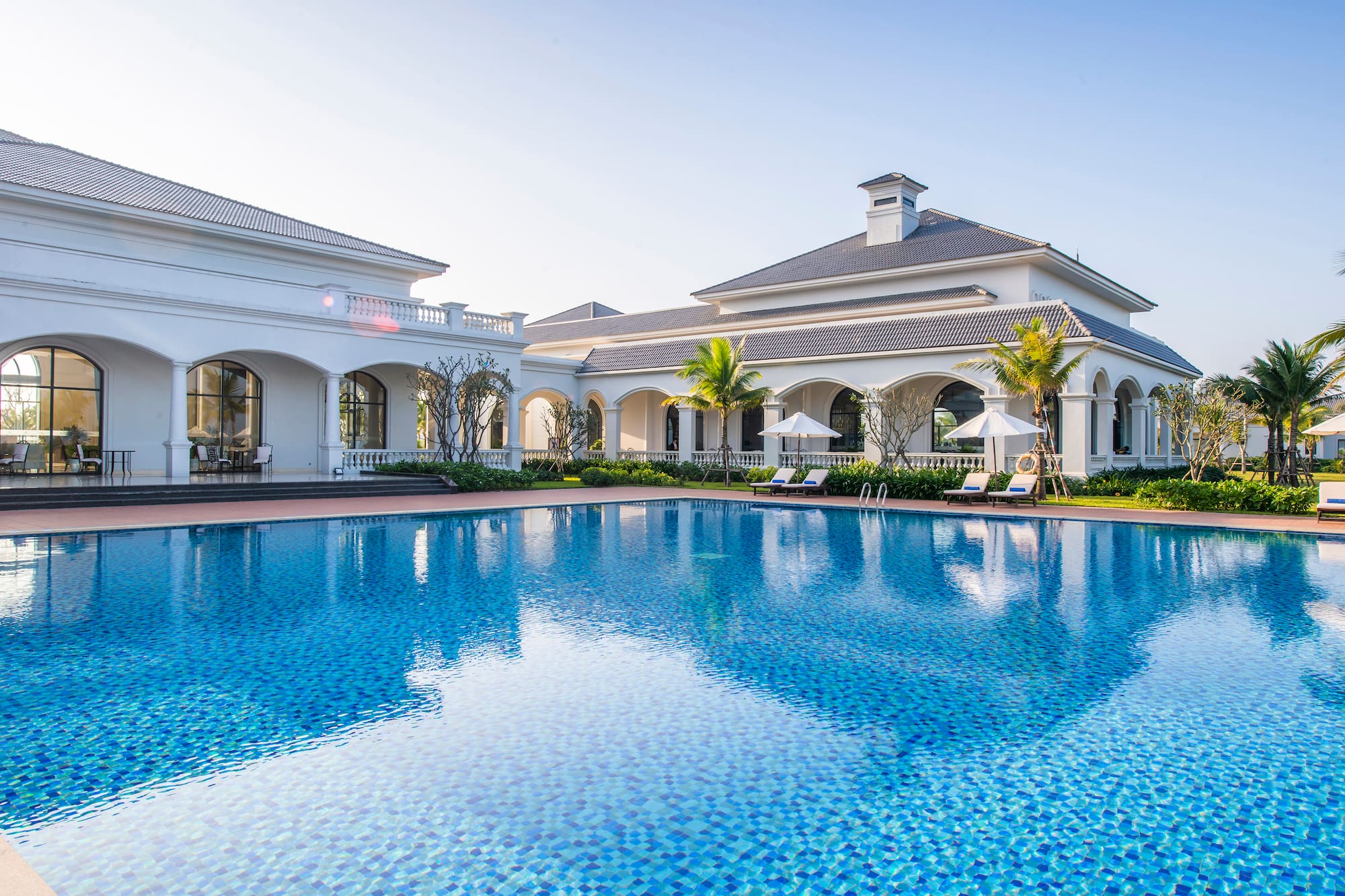a swimming pool in front of a building