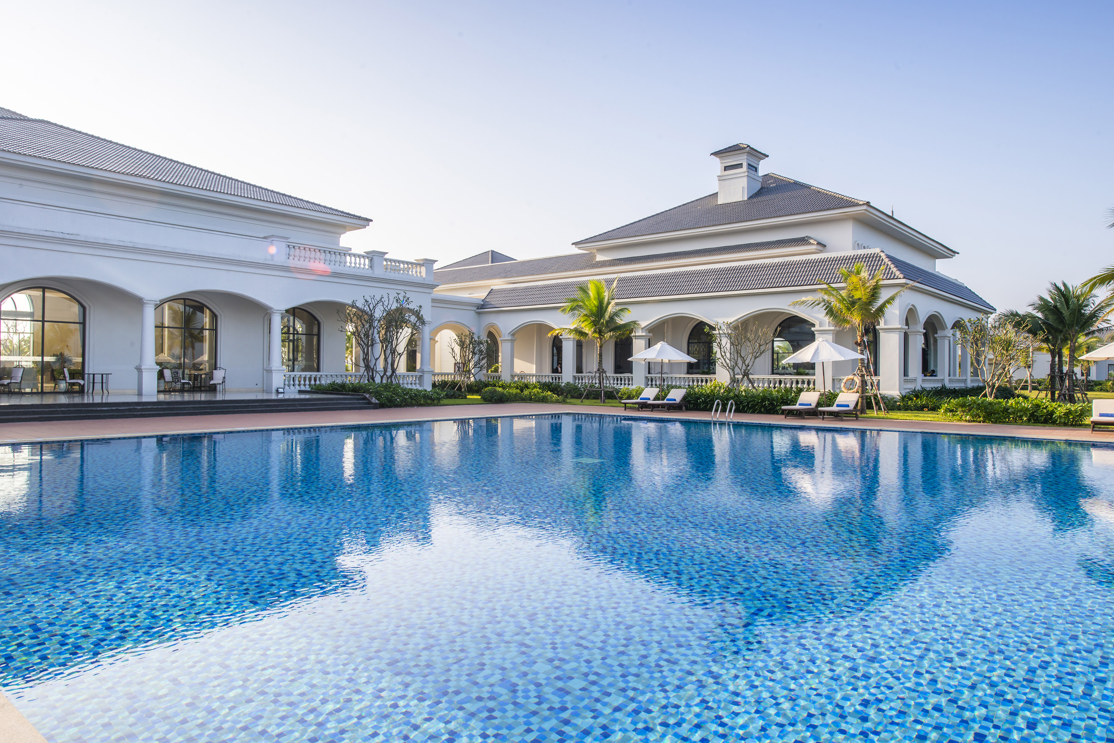 a swimming pool in front of a building