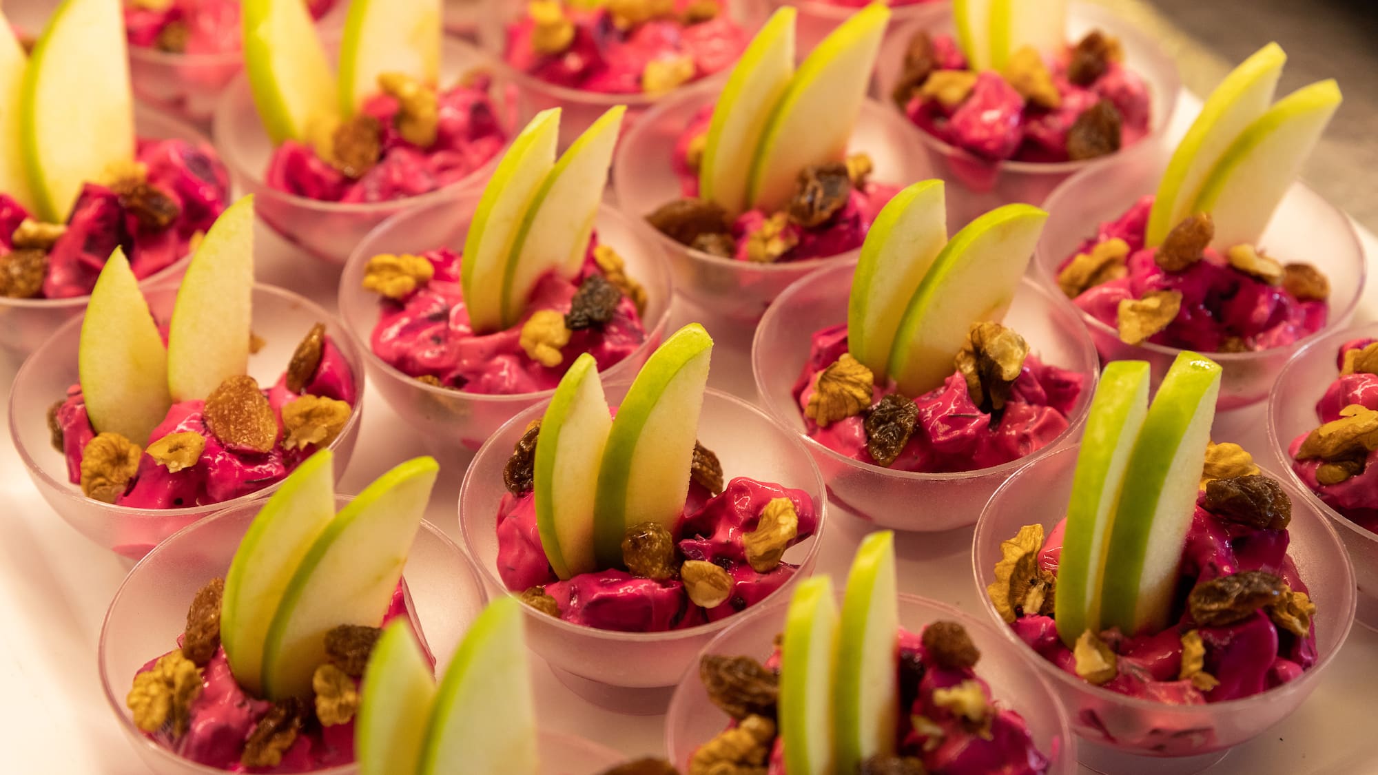 a group of small cups of food