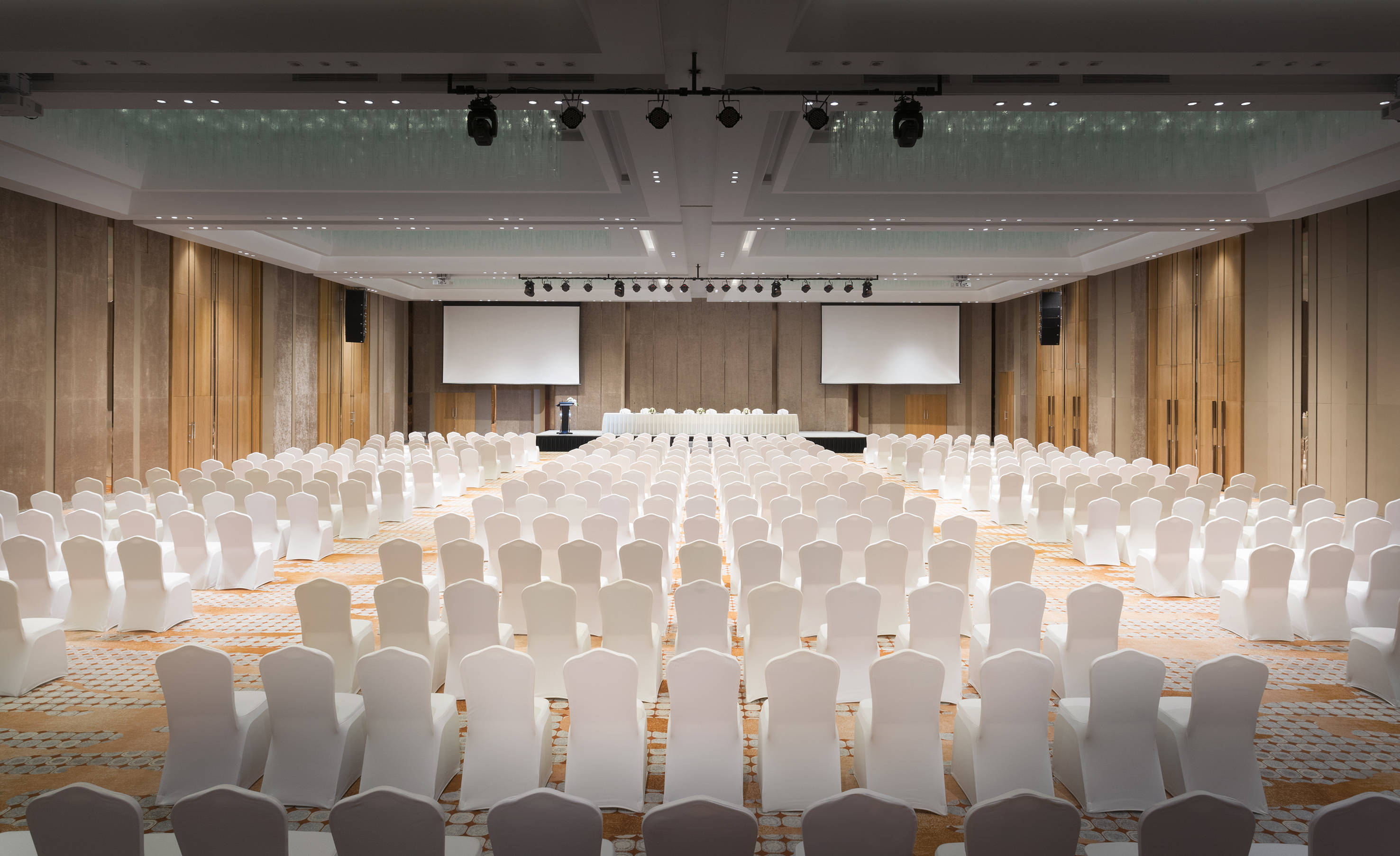 a large room with white chairs