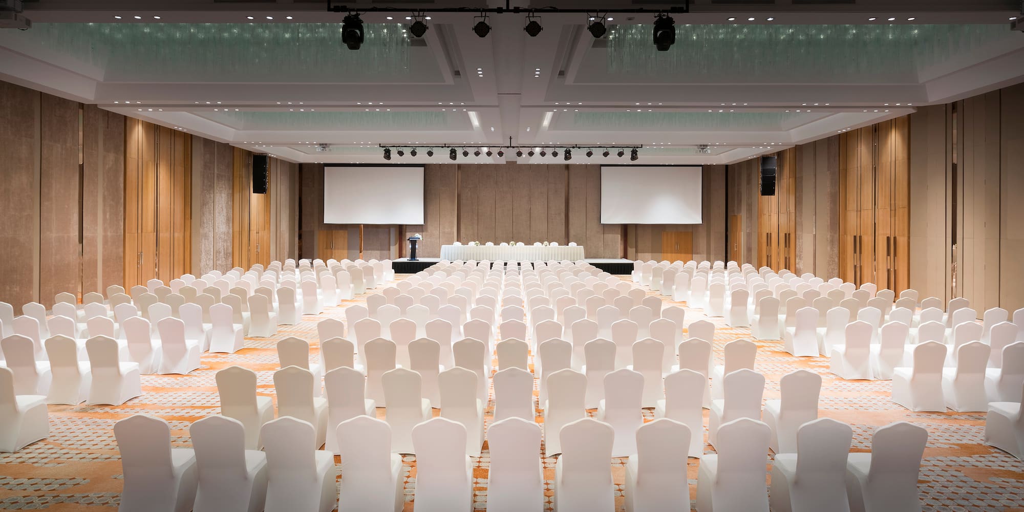 a large room with white chairs