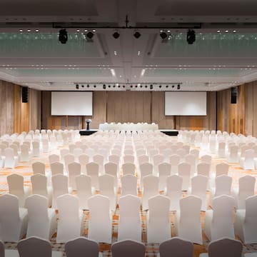 a large room with white chairs