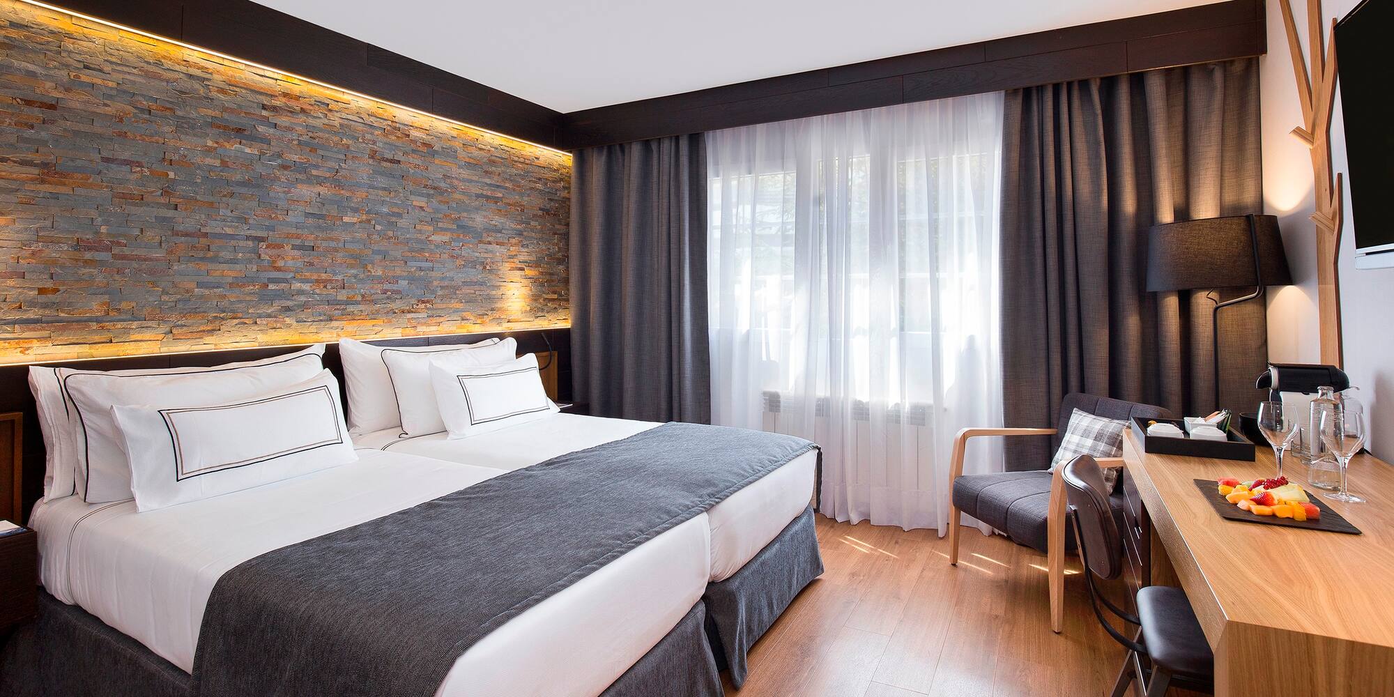 a room with a bed and a chair