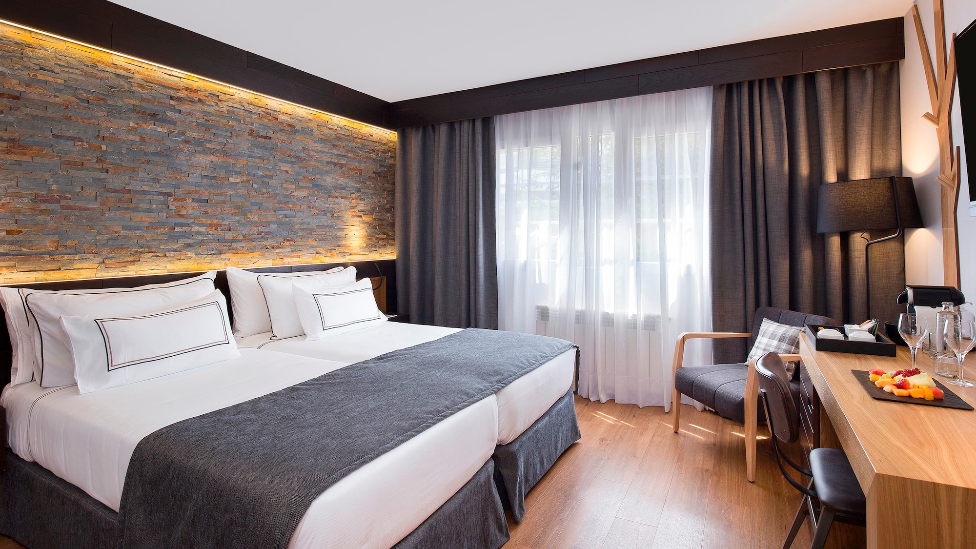 a room with a bed and a chair