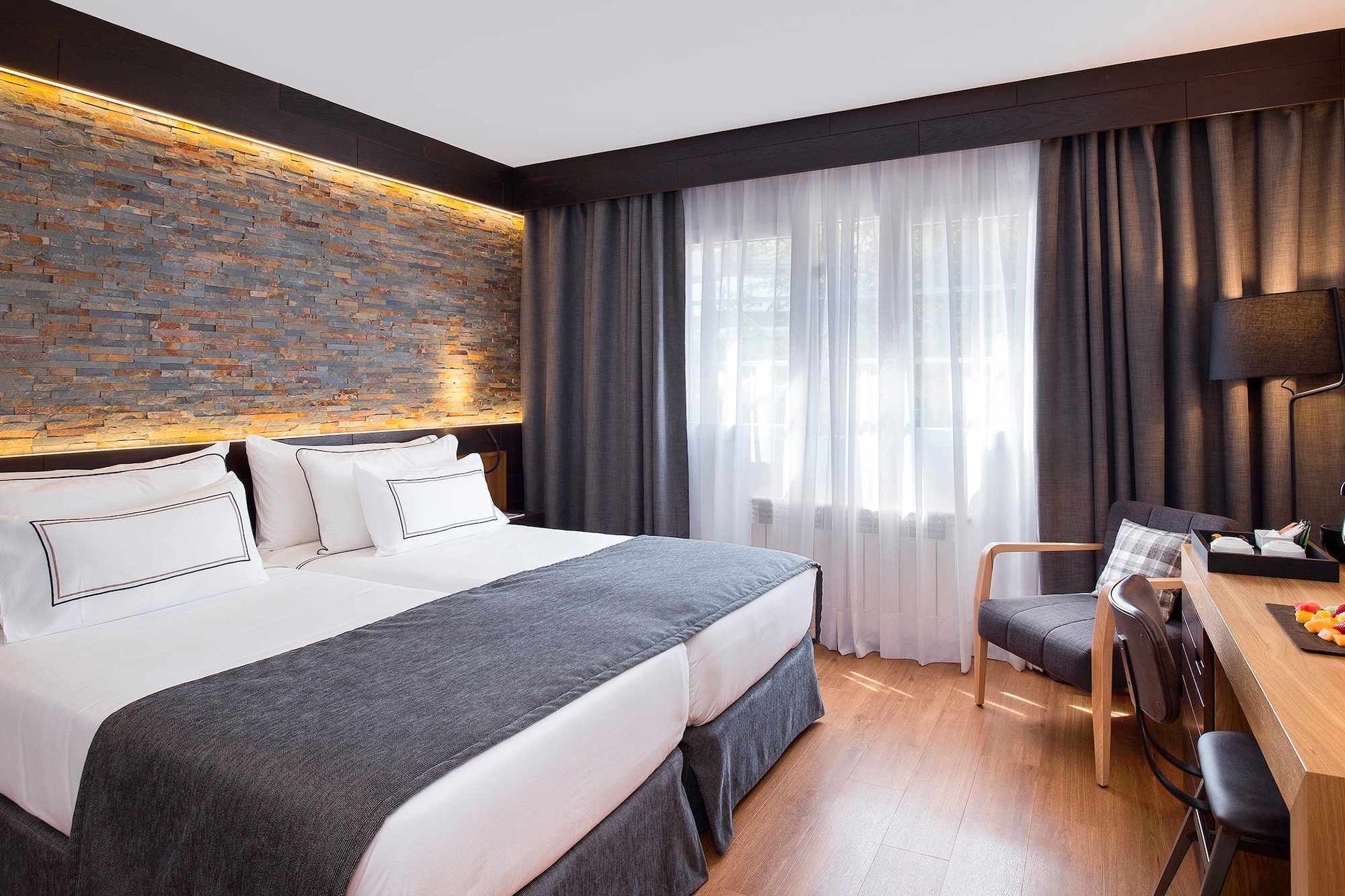 a room with a bed and a chair