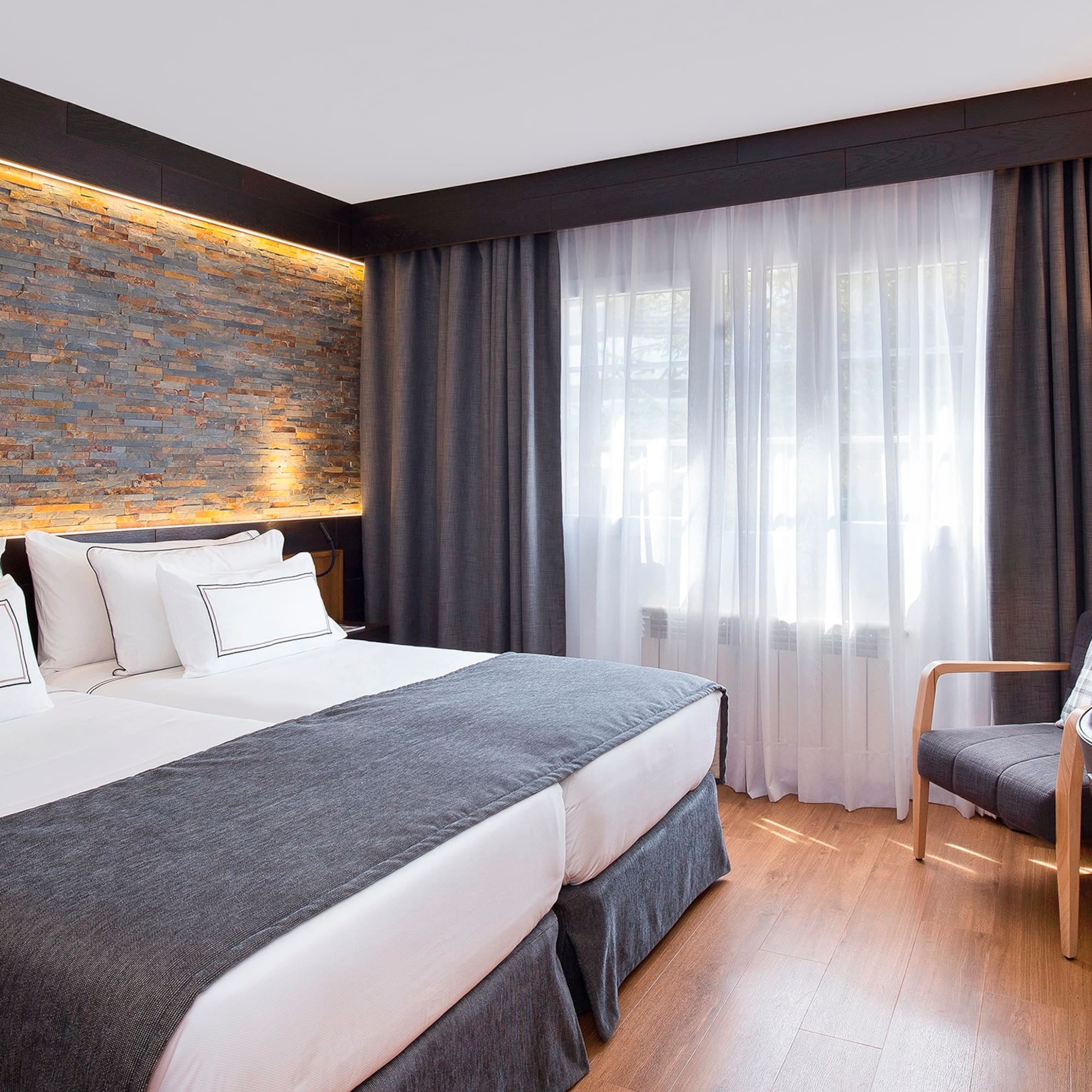 a room with a bed and a chair