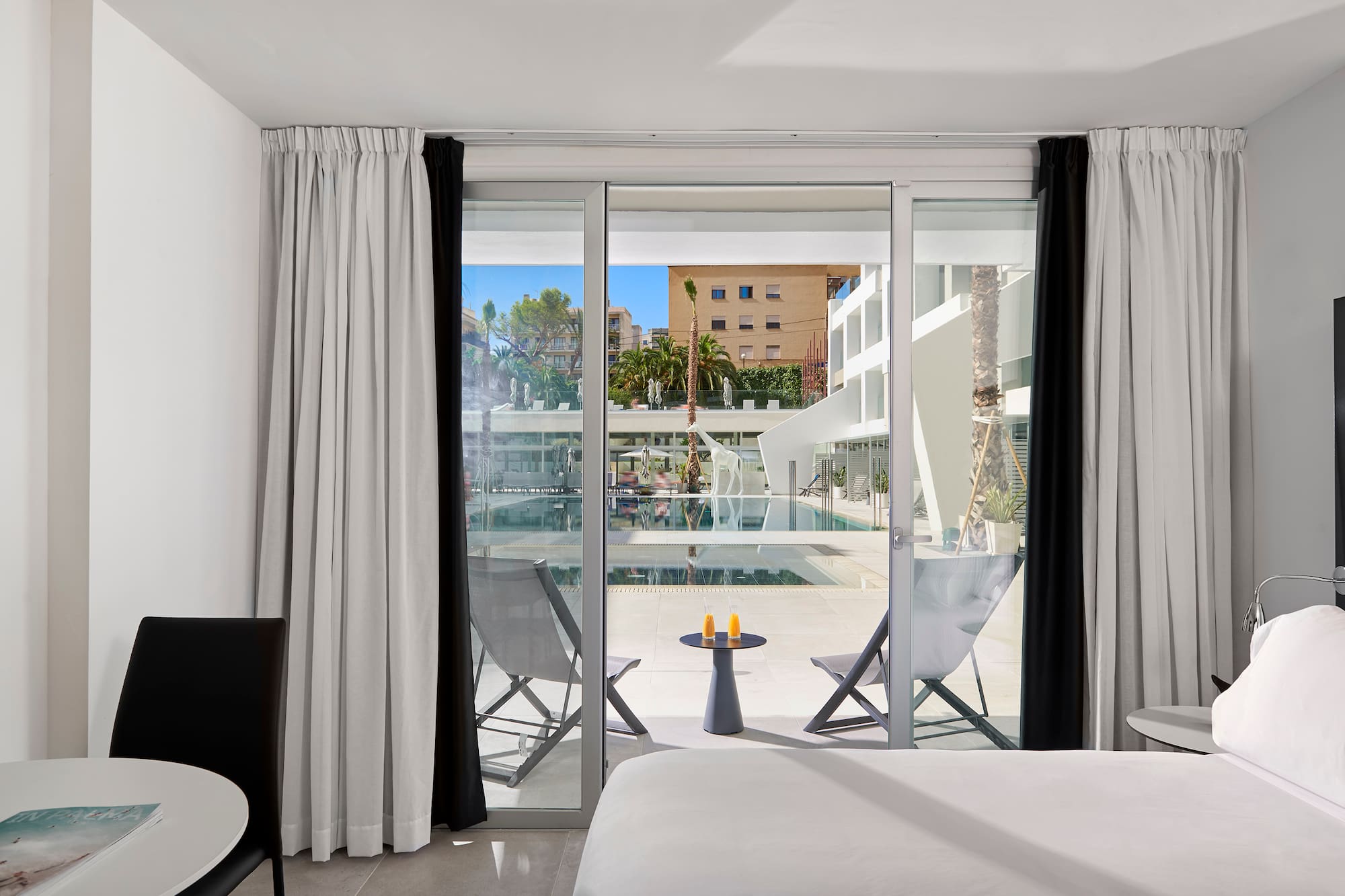 a room with a bed and a glass door