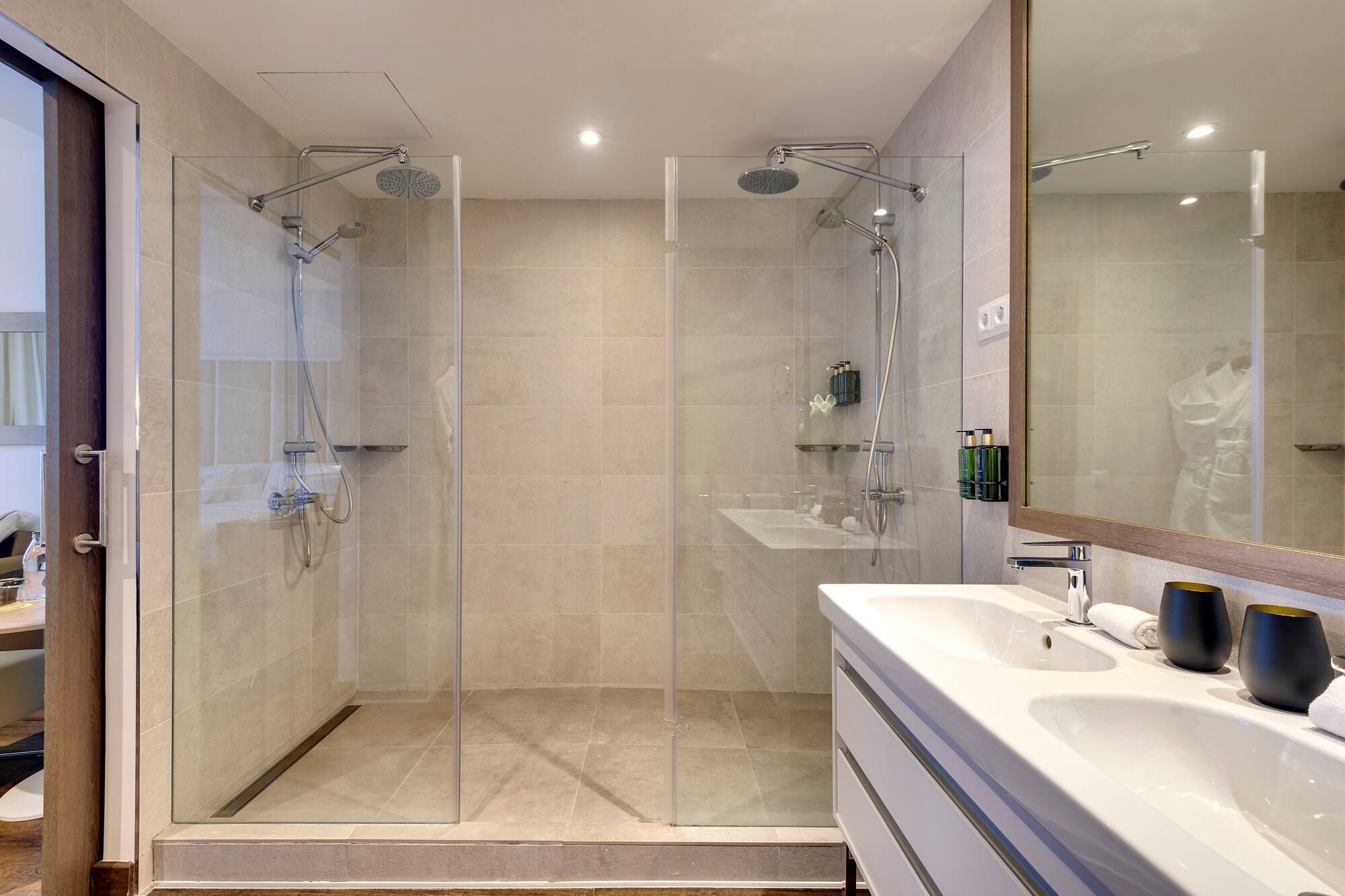 a bathroom with a shower and sink