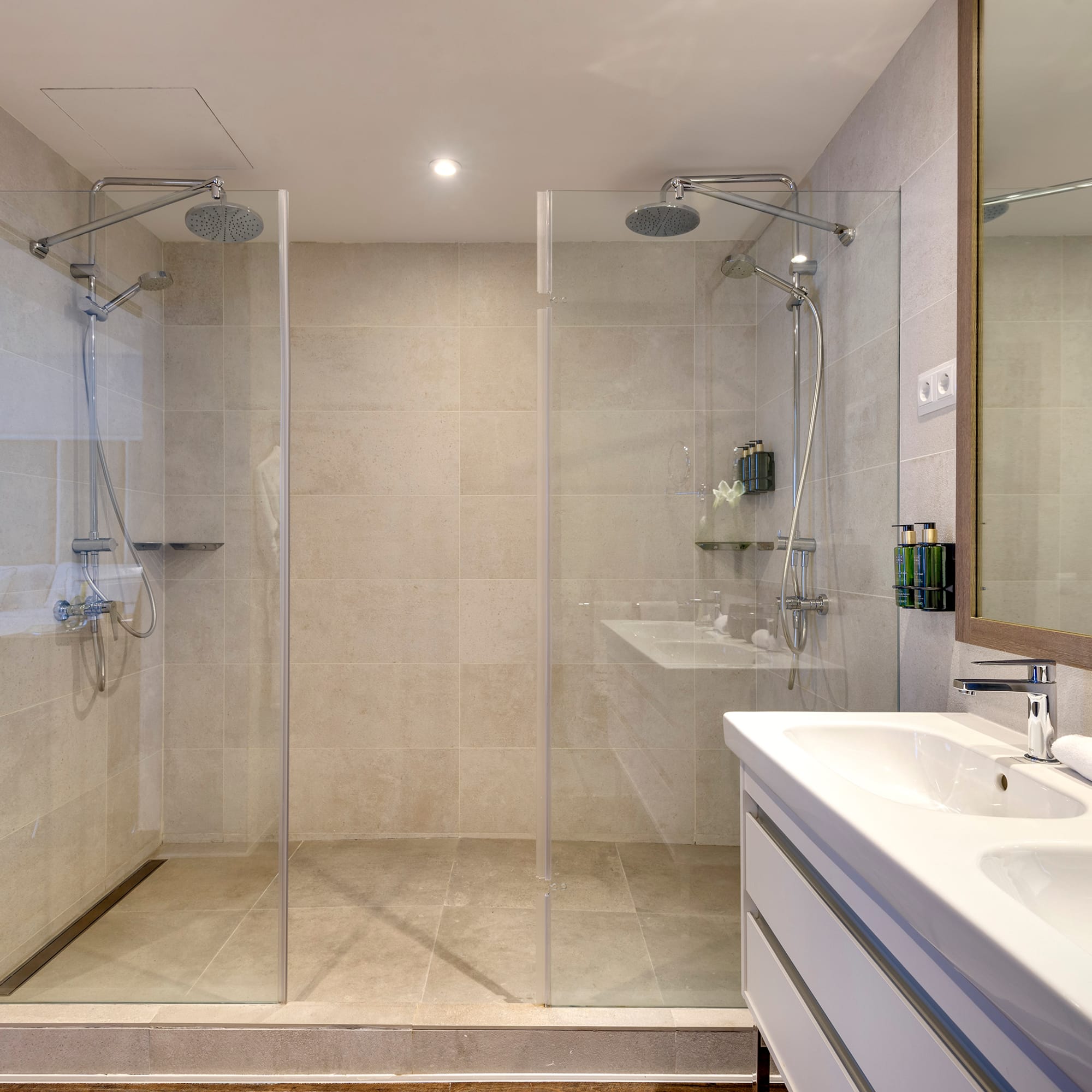 a bathroom with a shower and sink