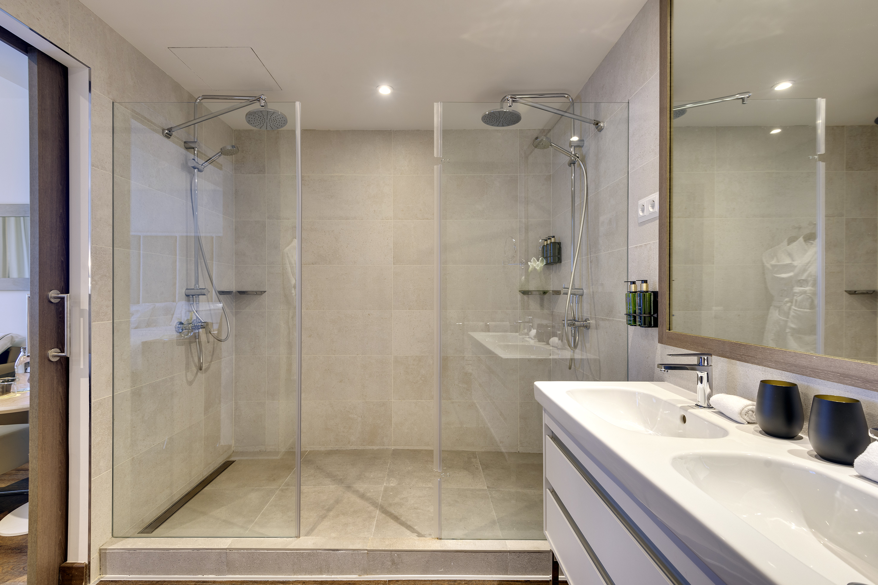 a bathroom with a shower and sink