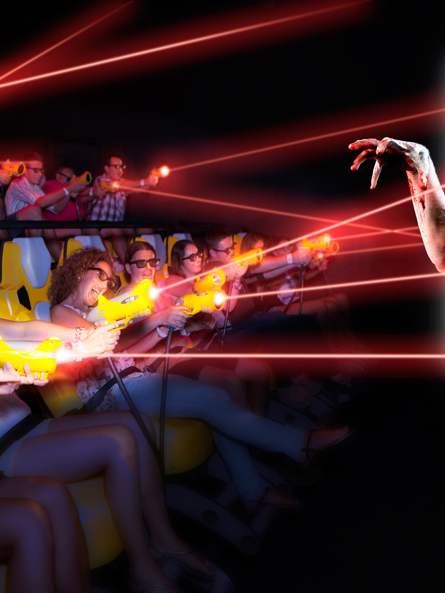 a group of people in a movie theater with laser guns