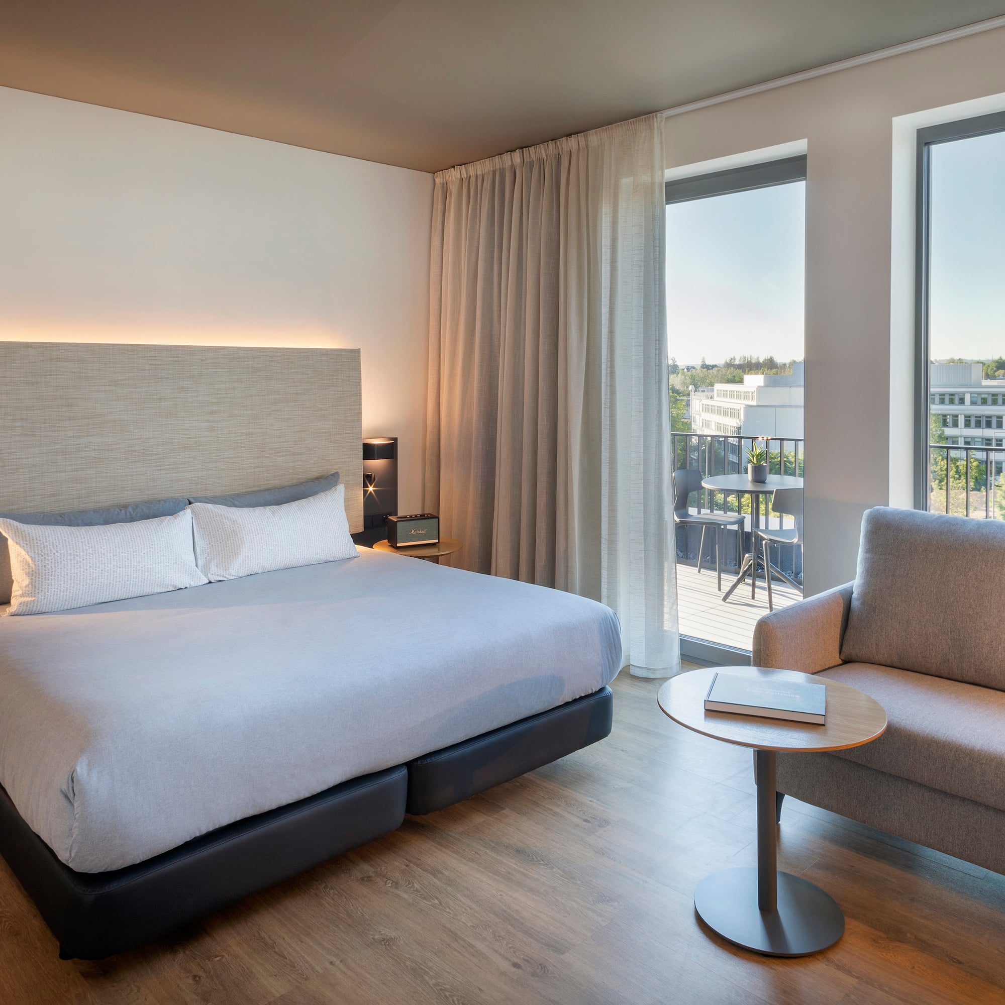 a bedroom with a bed and a chair