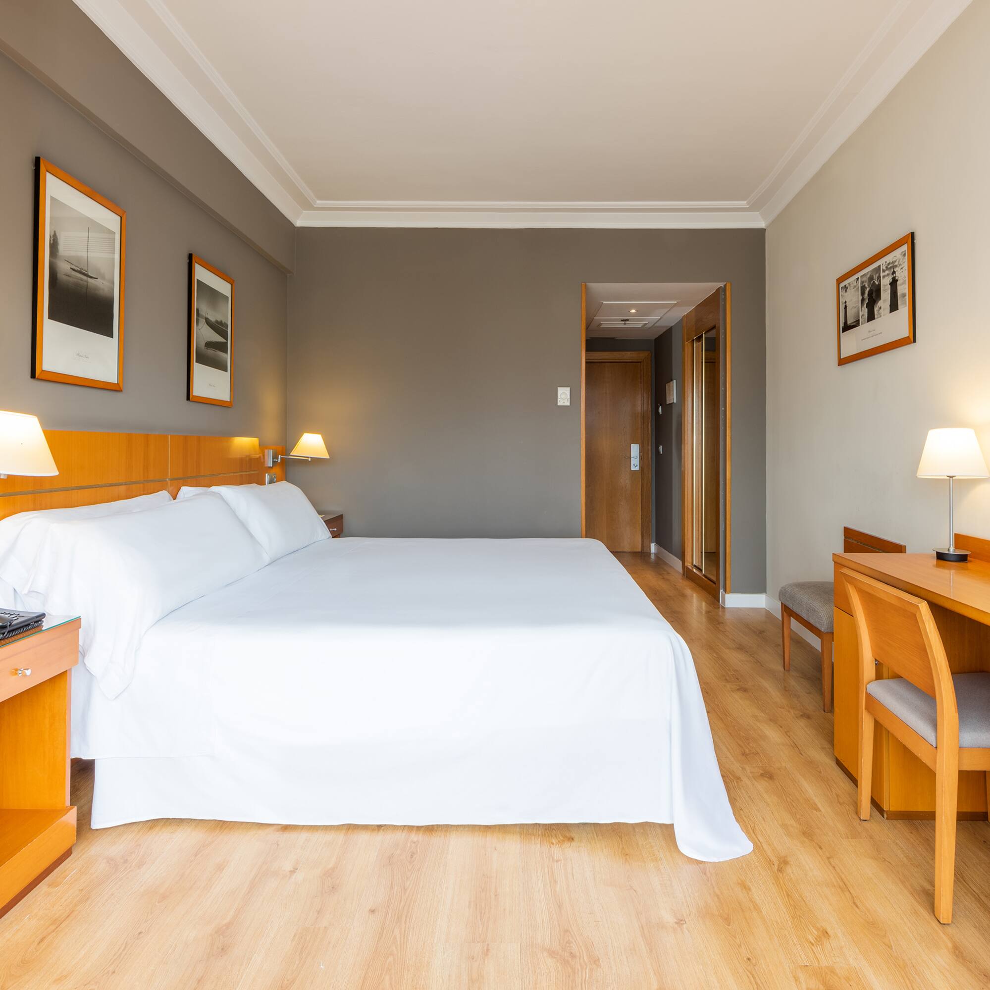 a room with a bed and a desk