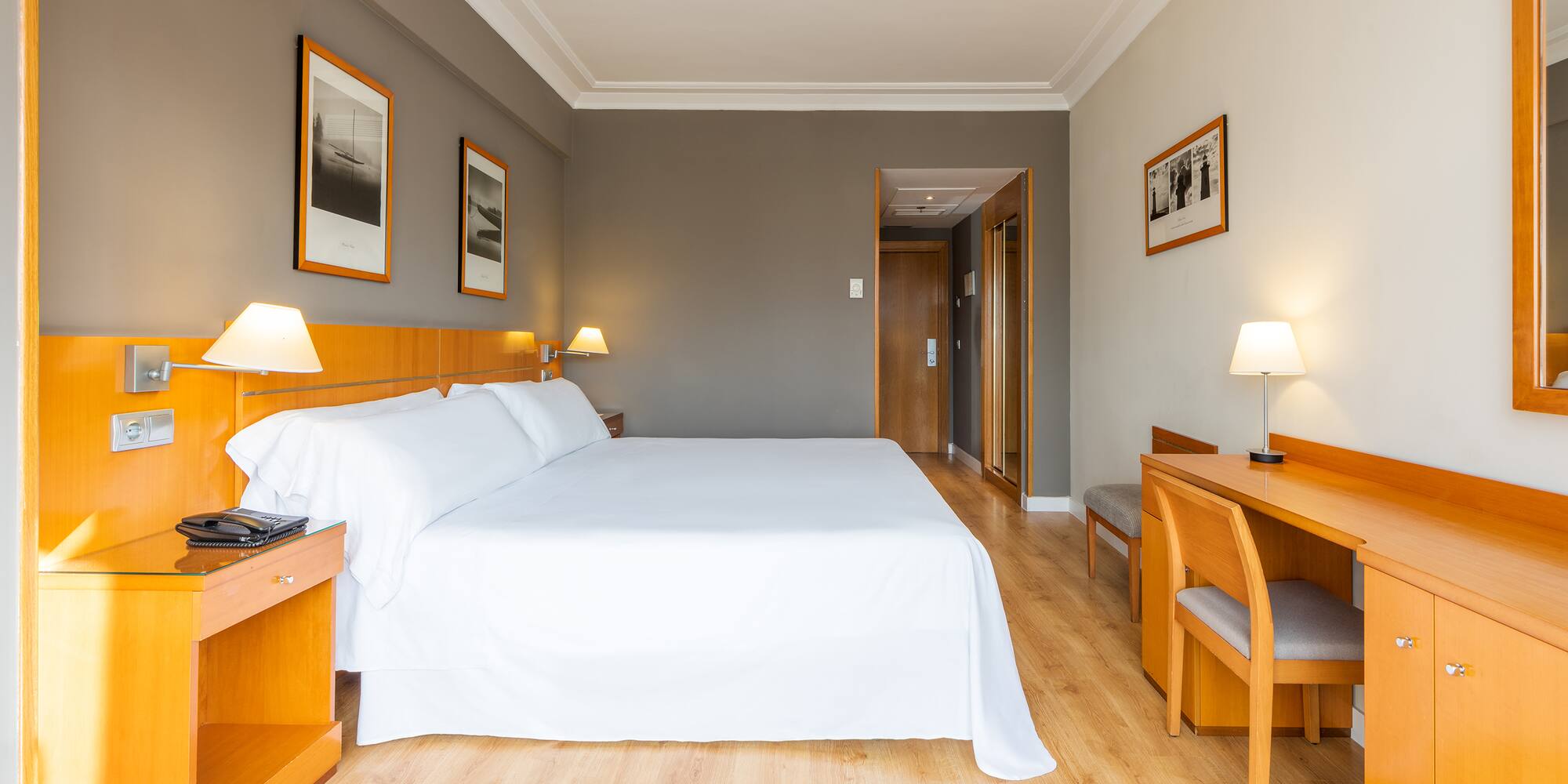 a room with a bed and a desk
