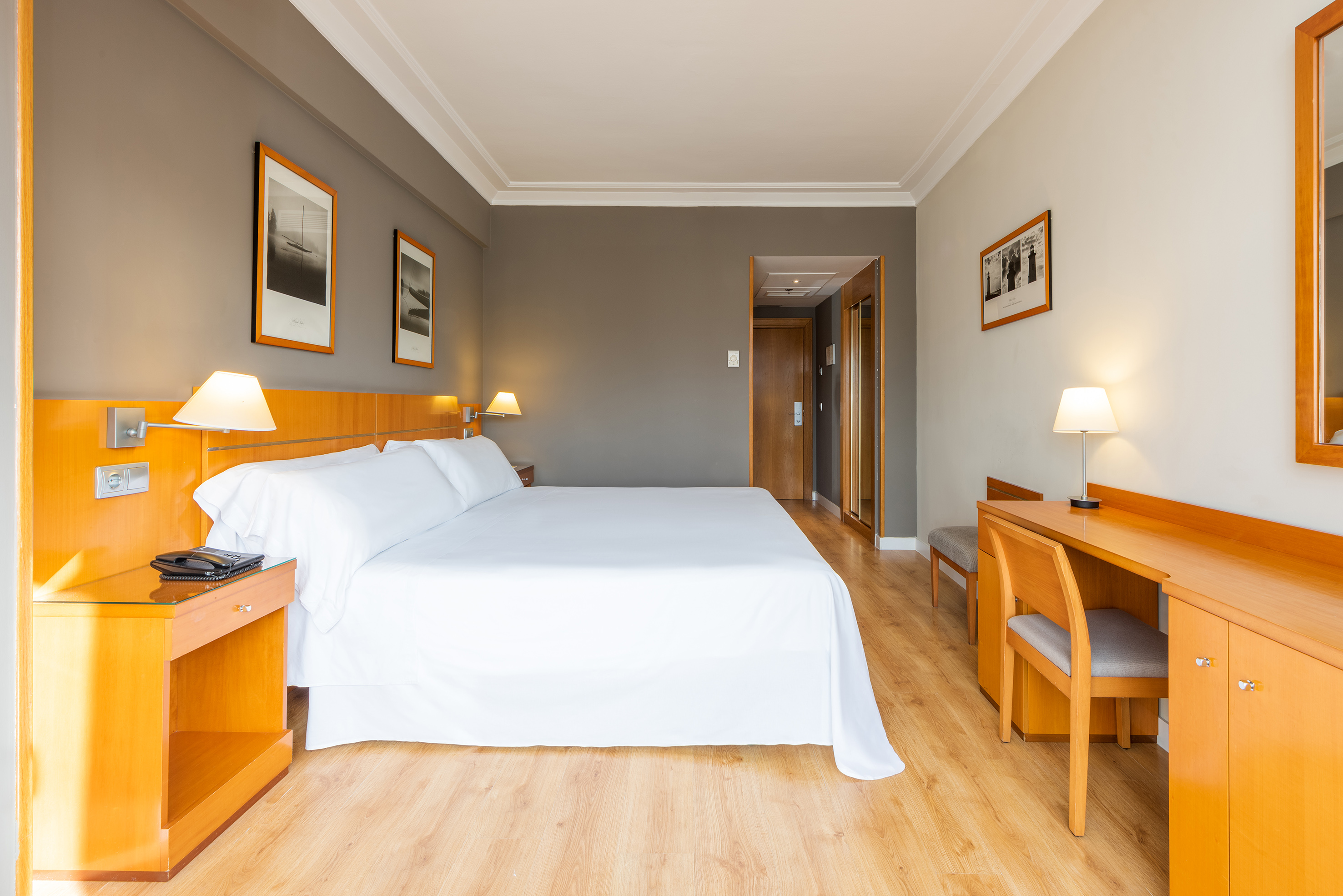 a room with a bed and a desk