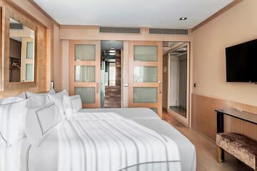 a room with two beds and a door