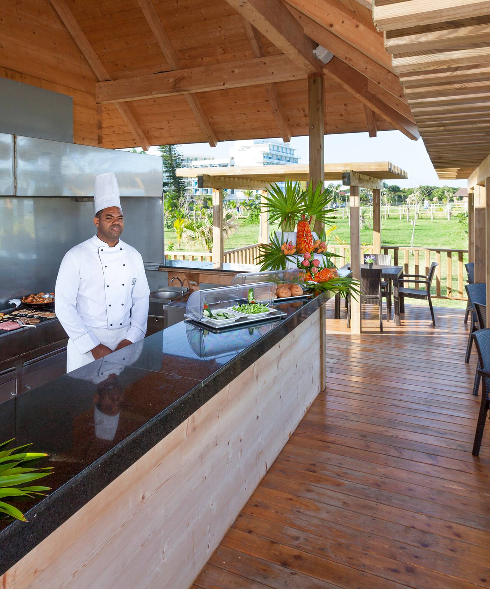 a chef standing at a bar