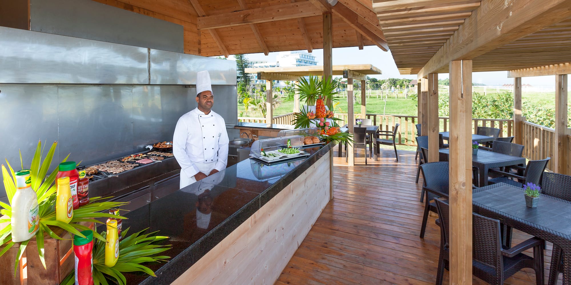 a chef standing at a bar