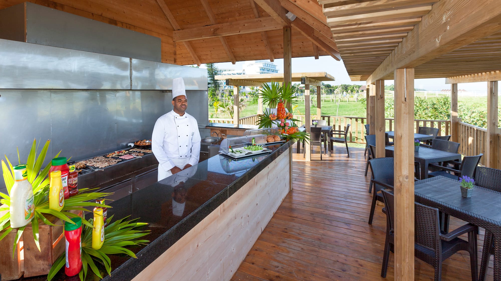 a chef standing at a bar